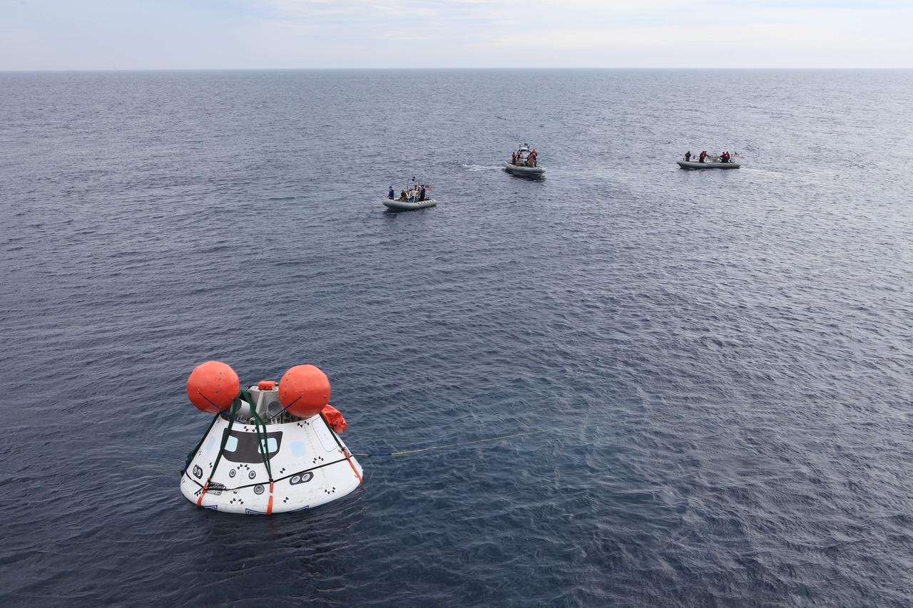 SAN DIEGO, Calif. – The Orion boilerplate test vehicle floats freely in the Pacific Ocean off the coast of San Diego during a portion of Underway Recovery Test 2. Nearby, U.S. Navy personnel in three rigid hull inflatable boats monitor Orion. NASA, Lockheed Martin and the U.S. Navy are conducting the test to prepare for recovery of the Orion crew module on its return from a deep space mission. The underway recovery test will allow the team to demonstrate and evaluate the recovery processes, procedures, new hardware and personnel in open waters.     The Ground Systems Development and Operations Program is conducting the underway recovery test. Orion is the exploration spacecraft designed to carry astronauts to destinations not yet explored by humans, including an asteroid and Mars. It will have emergency abort capability, sustain the crew during space travel and provide safe re-entry from deep space return velocities. The first unpiloted test flight of the Orion is scheduled to launch in 2014 atop a Delta IV rocket and in 2017 on NASA’s Space Launch System rocket. For more information, visit http://www.nasa.gov/orion. Photo credit: NASA/Kim Shiflett