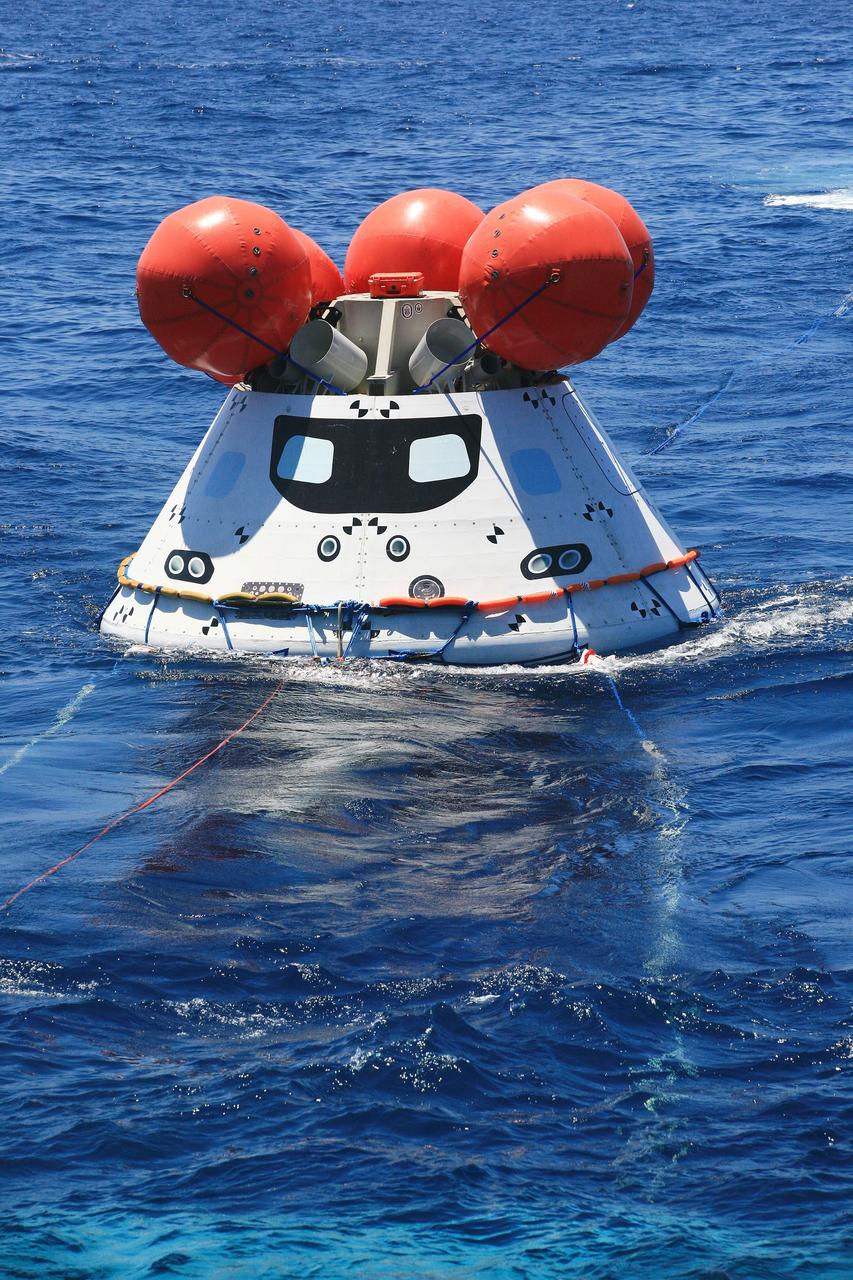 SAN DIEGO, Calif. – The tethered Orion boilerplate test vehicle floats in the Pacific Ocean off the coast of San Diego during a portion of Underway Recovery Test 2. The U.S. Navy’s USS Anchorage is on station nearby.    The testing is being conducted to prepare for recovery of the Orion crew module on its return from a deep-space mission. The underway recovery test will allow the team to demonstrate and evaluate the recovery processes, procedures, new hardware and personnel in open waters. The Ground Systems Development and Operations Program is conducting the underway recovery test. Orion is the exploration spacecraft designed to carry astronauts to destinations not yet explored by humans, including an asteroid and Mars. It will have emergency abort capability, sustain the crew during space travel and provide safe re-entry from deep-space return velocities. The first unpiloted test flight of the Orion is scheduled to launch in 2014 atop a Delta IV rocket and in 2017 on NASA’s Space Launch System rocket. For more information, visit http://www.nasa.gov/orion. Photo credit: NASA/Kim Shiflett