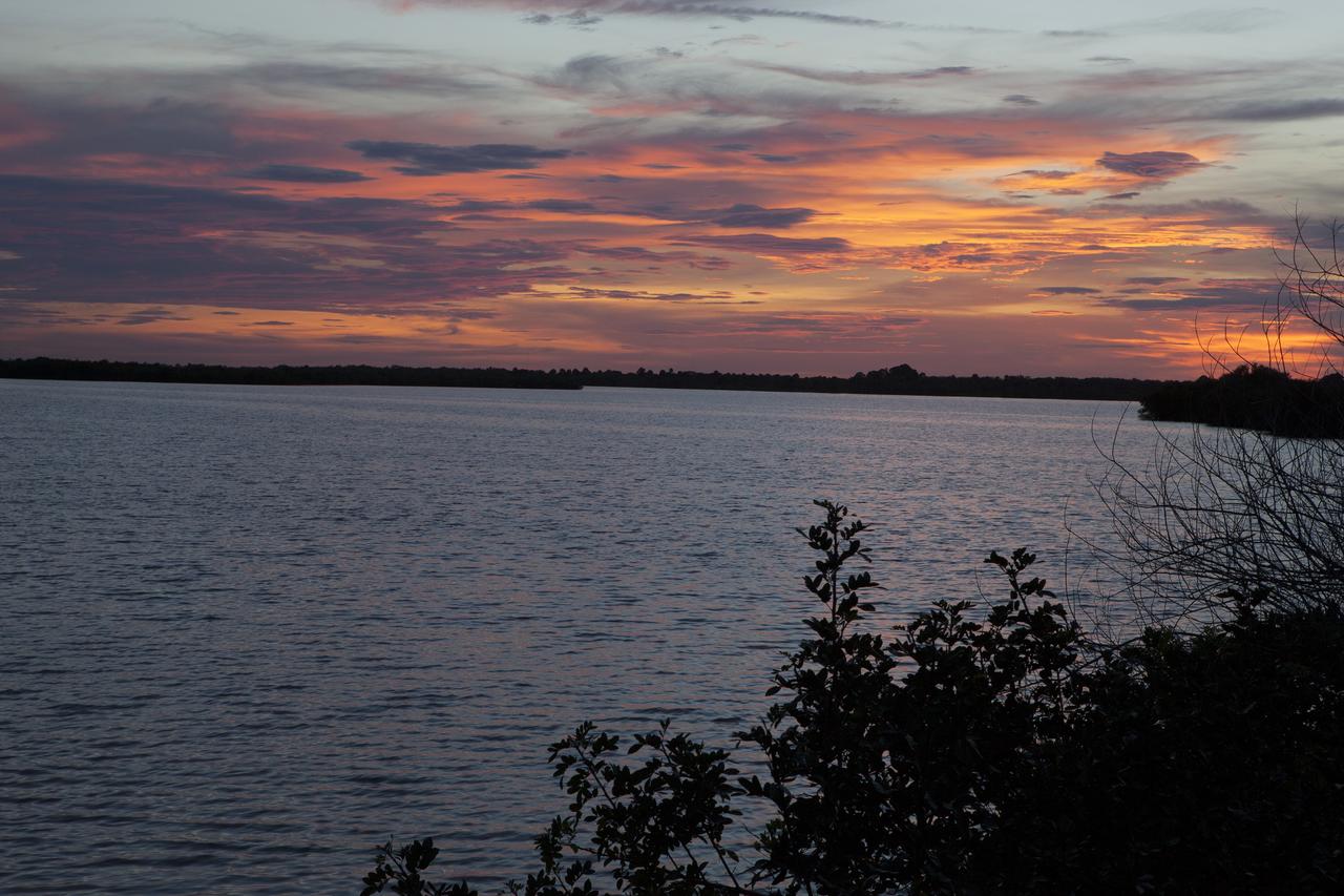 CAPE CANAVERAL, Fla. – Night falls over the turn basin in Launch Complex 39 at NASA’s Kennedy Space Center in Florida, bringing with it expectations of the appearance of a “supermoon.”    The scientific term for the supermoon phenomenon is "perigee moon." Full moons vary in size because of the oval shape of the moon's orbit. The moon follows an elliptical path around Earth with one side about 50,000 kilometers closer than the other. Full moons that occur on the perigee side of the moon's orbit seem extra big and bright. For additional information, visit http://science.nasa.gov/science-news/science-at-nasa/2014/10jul_supermoons/. Photo credit: NASA/Ben Smegelsky