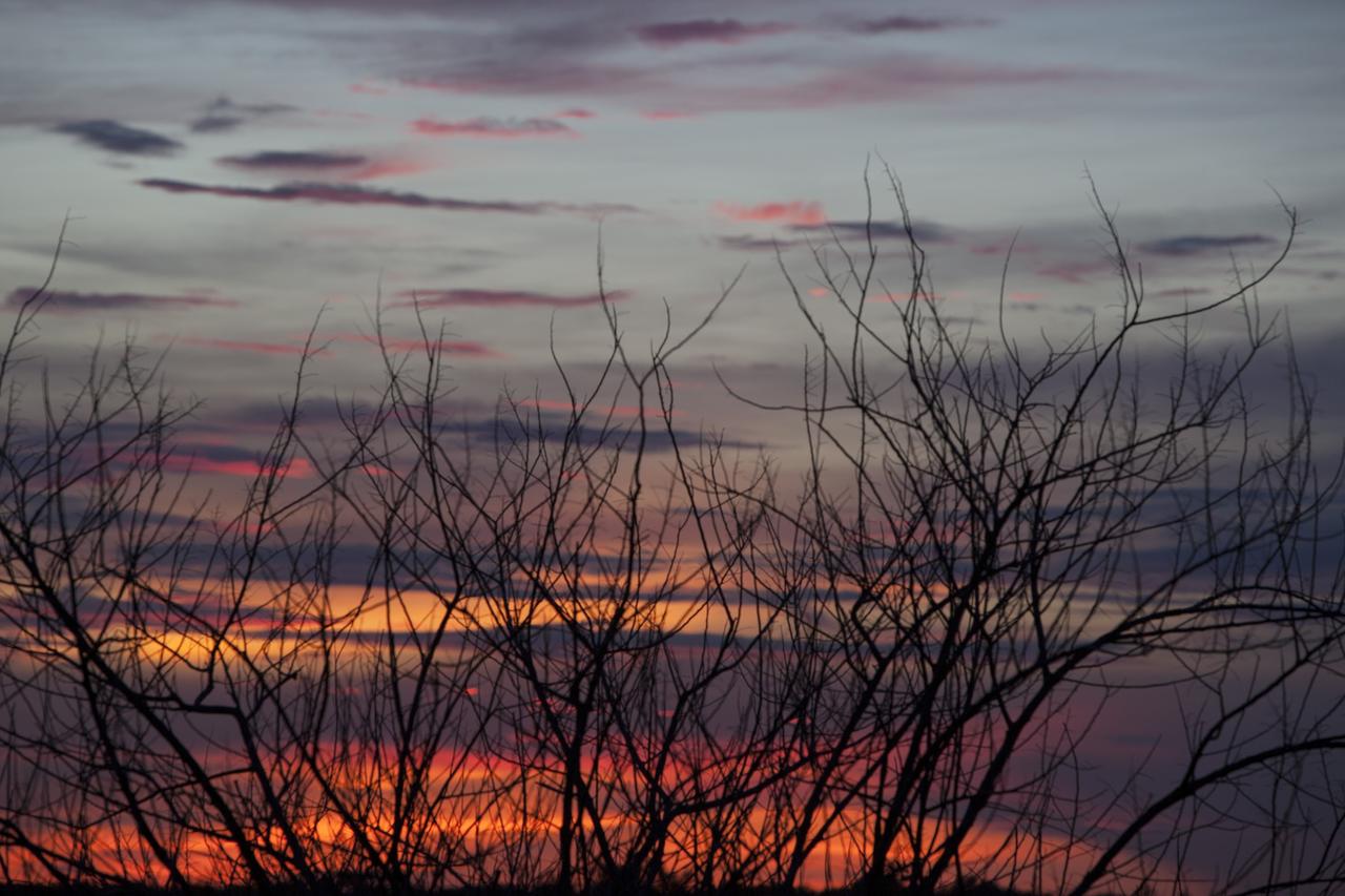 CAPE CANAVERAL, Fla. – The sky changes color as the sun sets over Launch Complex 39 at NASA’s Kennedy Space Center in Florida, bringing with it expectations of the appearance of a “supermoon.”    The scientific term for the supermoon phenomenon is "perigee moon." Full moons vary in size because of the oval shape of the moon's orbit. The moon follows an elliptical path around Earth with one side about 50,000 kilometers closer than the other. Full moons that occur on the perigee side of the moon's orbit seem extra big and bright. For additional information, visit http://science.nasa.gov/science-news/science-at-nasa/2014/10jul_supermoons/. Photo credit: NASA/Ben Smegelsky