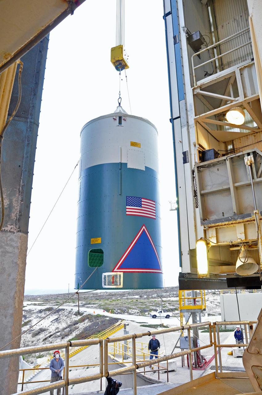 VANDENBERG AIR FORCE BASE, Calif. – The Delta II interstage adapter, or ISA, for NASA's Soil Moisture Active Passive mission, or SMAP, is hoisted up the side of the mobile service tower at Space Launch Complex 2 on Vandenberg Air Force Base in California.      Processing of the United Launch Alliance Delta II rocket that will loft SMAP into orbit is underway at the pad. The ISA connects the Delta II first and second stages and encloses the second stage engine and thrust section. The spacecraft will provide global measurements of soil moisture and its freeze/thaw state. These measurements will be used to enhance understanding of processes that link the water, energy and carbon cycles, and to extend the capabilities of weather and climate prediction models. The data returned also will be used to quantify net carbon flux in boreal landscapes and to develop improved flood prediction and drought monitoring capabilities. Launch is scheduled for November 2014. To learn more about SMAP, visit http://smap.jpl.nasa.gov.  Photo credit: NASA/Randy Beaudoin