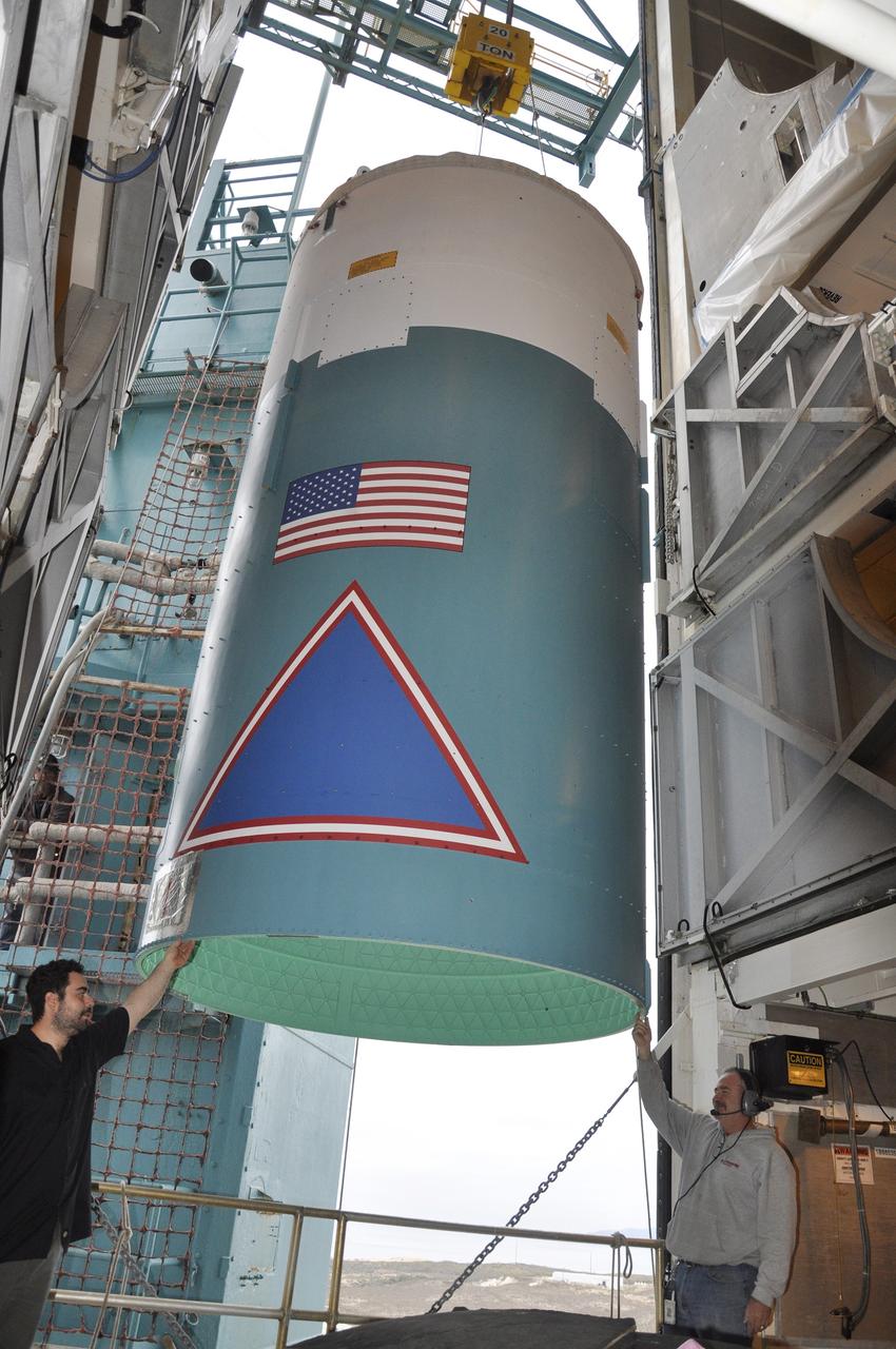 VANDENBERG AIR FORCE BASE, Calif. – The Delta II interstage adapter, or ISA, for NASA's Soil Moisture Active Passive mission, or SMAP, is transferred into the environmental enclosure in the mobile service tower at Space Launch Complex 2 on Vandenberg Air Force Base in California.    Processing of the United Launch Alliance Delta II rocket that will loft SMAP into orbit is underway at the pad. The ISA connects the Delta II first and second stages and encloses the second stage engine and thrust section. The spacecraft will provide global measurements of soil moisture and its freeze/thaw state. These measurements will be used to enhance understanding of processes that link the water, energy and carbon cycles, and to extend the capabilities of weather and climate prediction models. The data returned also will be used to quantify net carbon flux in boreal landscapes and to develop improved flood prediction and drought monitoring capabilities. Launch is scheduled for November 2014. To learn more about SMAP, visit http://smap.jpl.nasa.gov.  Photo credit: NASA/Randy Beaudoin