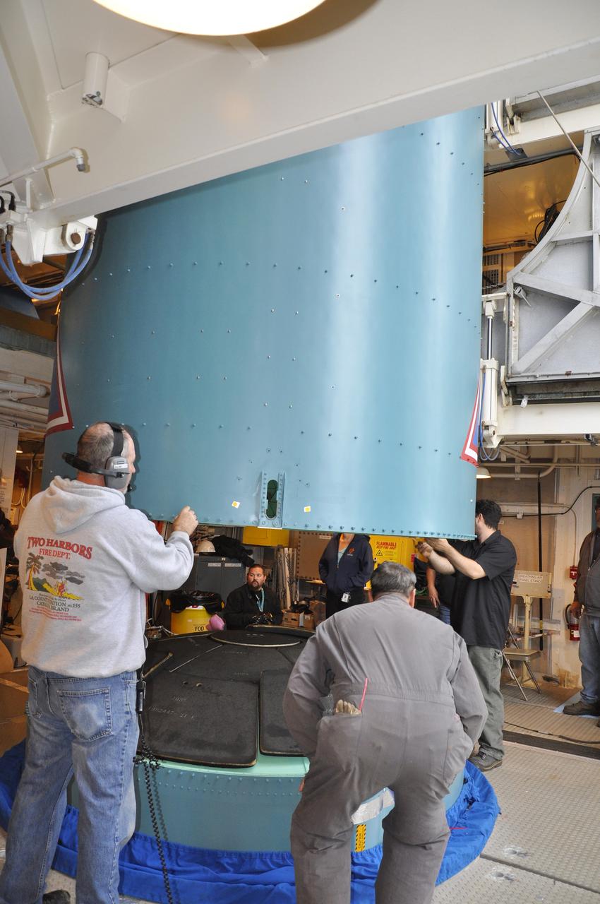 VANDENBERG AIR FORCE BASE, Calif. – Workers prepare to attach the Delta II interstage adapter, or ISA, for NASA's Soil Moisture Active Passive mission, or SMAP, to the rocket's first stage in the mobile service tower at Space Launch Complex 2 on Vandenberg Air Force Base in California.      Processing of the United Launch Alliance Delta II rocket that will loft SMAP into orbit is underway at the pad. The ISA connects the Delta II first and second stages and encloses the second stage engine and thrust section. The spacecraft will provide global measurements of soil moisture and its freeze/thaw state. These measurements will be used to enhance understanding of processes that link the water, energy and carbon cycles, and to extend the capabilities of weather and climate prediction models. The data returned also will be used to quantify net carbon flux in boreal landscapes and to develop improved flood prediction and drought monitoring capabilities. Launch is scheduled for November 2014. To learn more about SMAP, visit http://smap.jpl.nasa.gov.  Photo credit: NASA/Randy Beaudoin