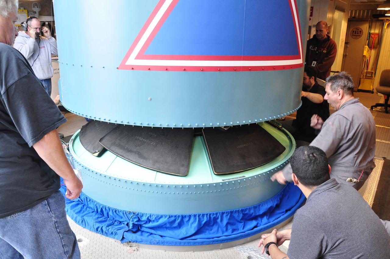 VANDENBERG AIR FORCE BASE, Calif. – The Delta II interstage adapter, or ISA, for NASA's Soil Moisture Active Passive mission, or SMAP, is lowered into place on the rocket's first stage in the mobile service tower at Space Launch Complex 2 on Vandenberg Air Force Base in California.    Processing of the United Launch Alliance Delta II rocket that will loft SMAP into orbit is underway at the pad. The ISA connects the Delta II first and second stages and encloses the second stage engine and thrust section. The spacecraft will provide global measurements of soil moisture and its freeze/thaw state. These measurements will be used to enhance understanding of processes that link the water, energy and carbon cycles, and to extend the capabilities of weather and climate prediction models. The data returned also will be used to quantify net carbon flux in boreal landscapes and to develop improved flood prediction and drought monitoring capabilities. Launch is scheduled for November 2014. To learn more about SMAP, visit http://smap.jpl.nasa.gov.  Photo credit: NASA/Randy Beaudoin