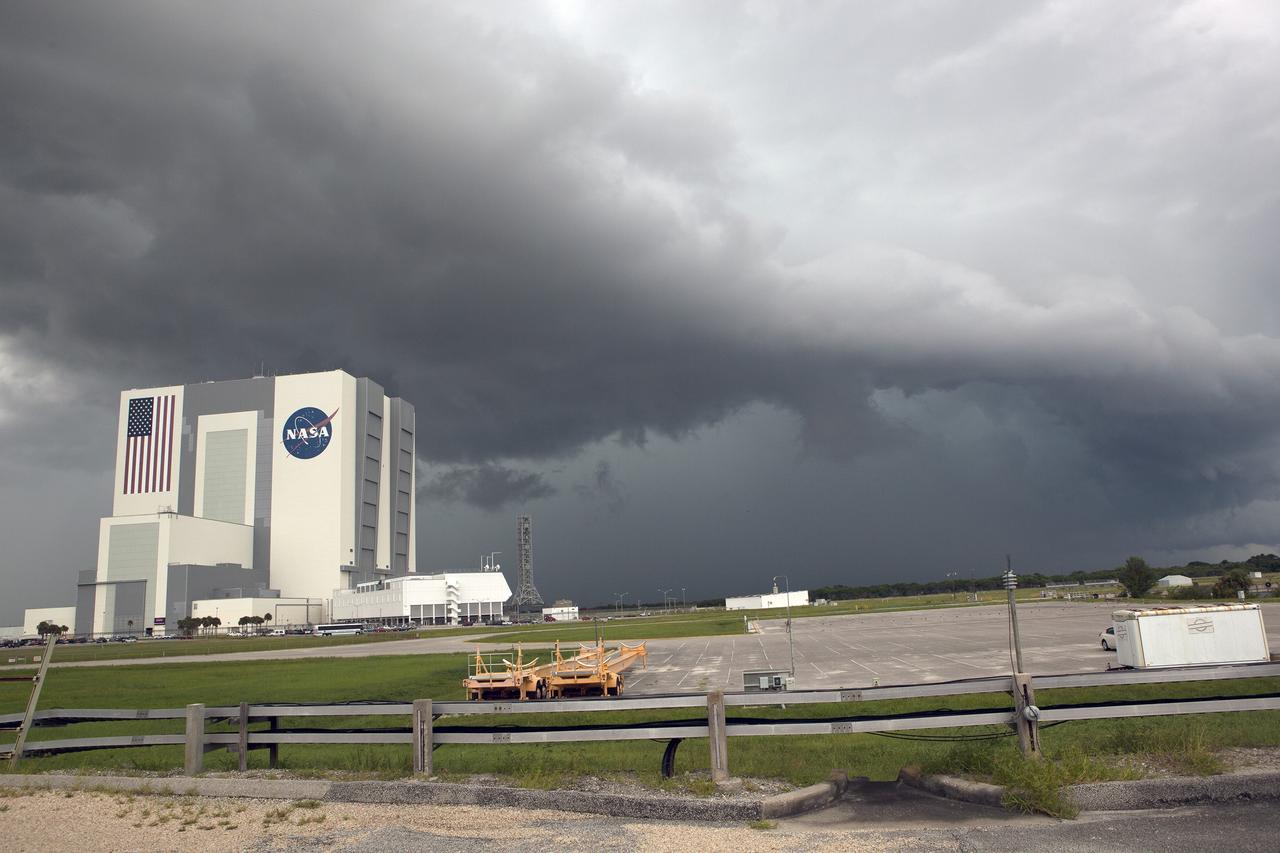 CAPE CANAVERAL, Fla. – A menacing thunderstorm hovers over Launch Complex 39 at NASA’s Kennedy Space Center in Florida. At left are the behemoth Vehicle Assembly Building, the Launch Control Center and the mobile launcher that will support NASA's Space Launch System heavy-lift rocket, under development. Kennedy's Ground Support Development and Operations Program is hard at work transforming the center's facilities into a multi-user spaceport, when the weather permits. For more on Kennedy Space Center, visit http://www.nasa.gov/kennedy. Photo credit: NASA/Ben Smegelsky