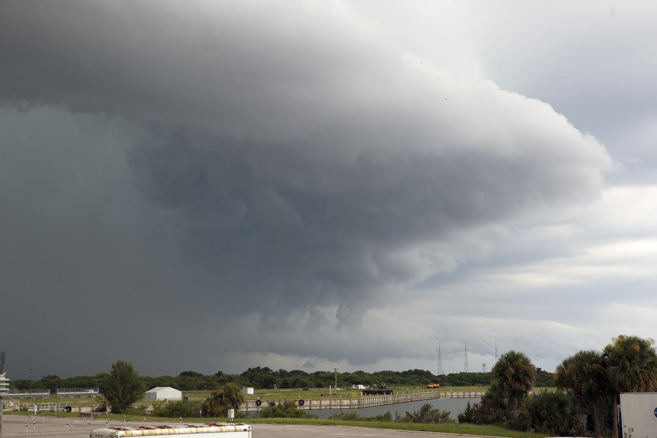 CAPE CANAVERAL, Fla. – A thunderstorm moving through NASA’s Kennedy Space Center in Florida approaches Launch Pad 39B, in the distance.    Kennedy's Ground Support Development and Operations Program is hard at work transforming the center's facilities into a multi-user spaceport, when the weather permits. For more on Kennedy Space Center, visit http://www.nasa.gov/kennedy. Photo credit: NASA/Ben Smegelsky