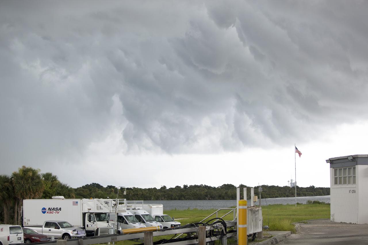 CAPE CANAVERAL, Fla. – A thunderstorm moving through NASA’s Kennedy Space Center in Florida hovers over the NASA Press Site.  In the distance is Launch Pad 39A, recently turned over to SpaceX to support their commercial launch activities under a property agreement.    Kennedy's Ground Support Development and Operations Program is hard at work transforming the center's facilities into a multi-user spaceport, when the weather permits. For more on Kennedy Space Center, visit http://www.nasa.gov/kennedy. Photo credit: NASA/Ben Smegelsky