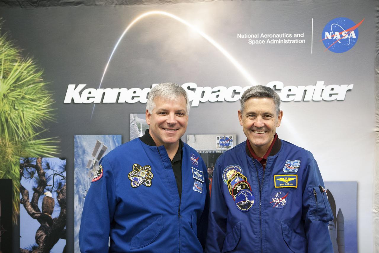 CAPE CANAVERAL, Fla. – Former astronaut Greg Johnson, at left, executive director of the Center for the Advancement of Science in Space, and NASA Kennedy Space Center Director Bob Cabana, visit with Florida middle school students and their teachers before the start of the Zero Robotics finals competition at NASA Kennedy Space Center's Space Station Processing Facility in Florida. Students designed software to control Synchronized Position Hold Engage and Reorient Experimental Satellites, or SPHERES, and competed with other teams locally. The Zero Robotics is a robotics programming competition where the robots are SPHERES. The competition starts online, where teams program the SPHERES to solve an annual challenge. After several phases of virtual competition in a simulation environment that mimics the real SPHERES, finalists are selected to compete in a live championship aboard the space station. Students compete to win a technically challenging game by programming their strategies into the SPHERES satellites. The programs are autonomous and the students cannot control the satellites during the test. Photo credit: NASA/Daniel Casper