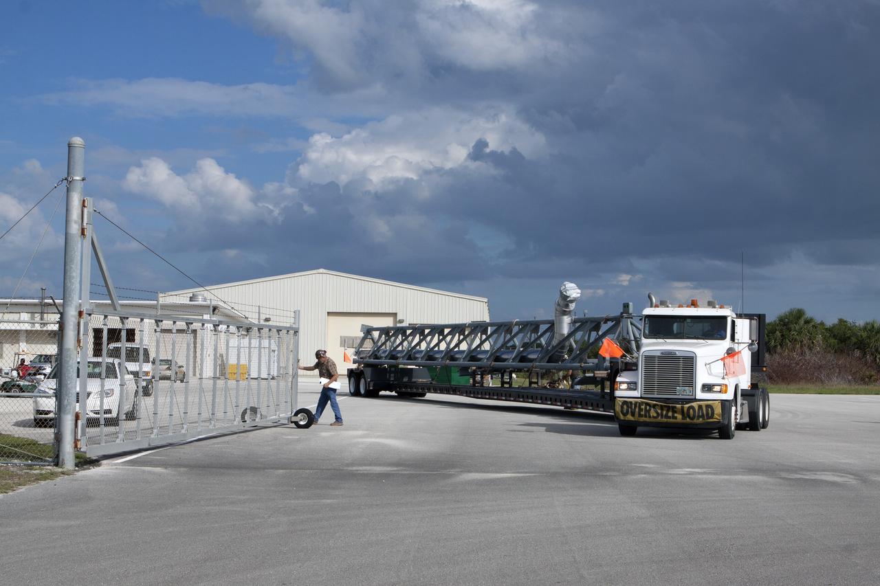 CAPE CANAVERAL, Fla. – The umbilical swing arm for Exploration Flight Test 1, or EFT-1, arrives at the Horizontal Integration Facility near Space Launch Complex 37 at Cape Canaveral Air Force Station in Florida. The swing arm is the uppermost of three swing arms that will be attached to the fixed umbilical tower on the launch pad.    The swing arm will carry umbilicals that will be mated to Orion's launch abort system and environmental control system. During launch, the umbilicals will pull away from Orion and the United Launch Alliance Delta IV Heavy rocket at T-0. During the EFT-1 mission, Orion will travel farther into space than any human spacecraft has gone in more than 40 years.  The data gathered during the flight will influence design decisions, validate existing computer models and innovative new approaches to space systems development, as well as reduce overall mission risks and costs for later Orion flights. Liftoff of Orion on its first flight test is planned for fall 2014. Photo credit: NASA/Kim Shiflett