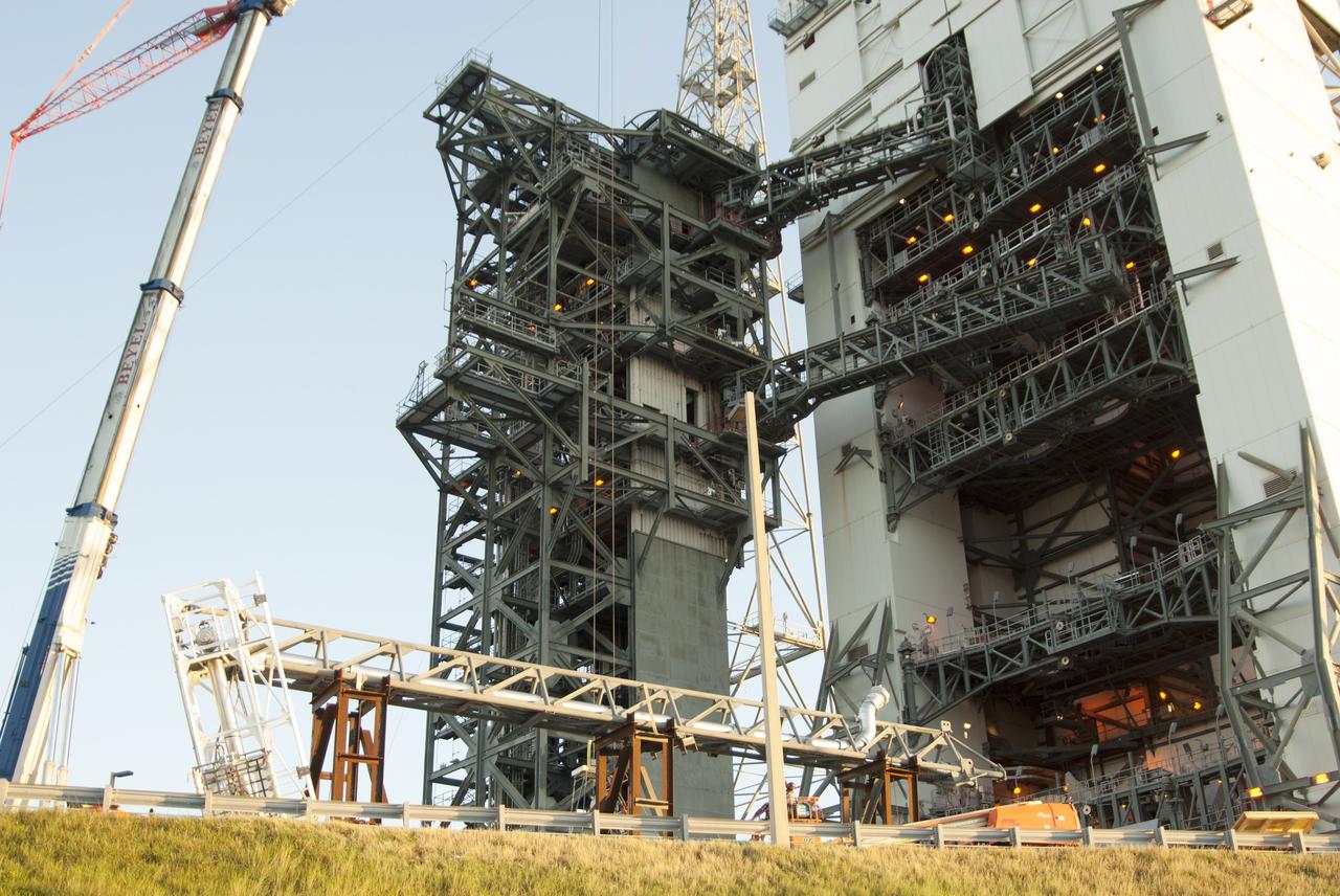 CAPE CANAVERAL, Fla. – The umbilical swing arm for Exploration Flight Test 1, or EFT-1, arrives at the launch pad at Space Launch Complex 37 at Cape Canaveral Air Force Station in Florida. The swing arm is the uppermost of three swing arms that will be attached to the fixed umbilical tower on the launch pad.      The swing arm will carry umbilicals that will be mated to Orion's launch abort system and environmental control system. During launch, the umbilicals will pull away from Orion and the United Launch Alliance Delta IV Heavy rocket at T-0. During the EFT-1 mission, Orion will travel farther into space than any human spacecraft has gone in more than 40 years.  The data gathered during the flight will influence design decisions, validate existing computer models and innovative new approaches to space systems development, as well as reduce overall mission risks and costs for later Orion flights. Liftoff of Orion on its first flight test is planned for fall 2014. Photo credit: NASA/Jim Grossmann