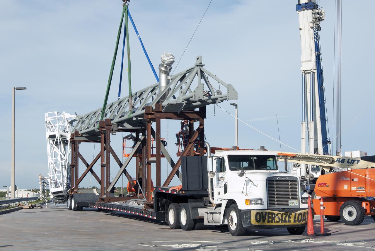 CAPE CANAVERAL, Fla. – The umbilical swing arm for Exploration Flight Test 1, or EFT-1, is being prepared to be lifted by crane and attached to the fixed umbilical tower at Space Launch Complex 37 at Cape Canaveral Air Force Station in Florida. The swing arm is the uppermost of three swing arms that will be attached to the fixed umbilical tower.     The swing arm will carry umbilicals that will be mated to Orion's launch abort system and environmental control system. During launch, the umbilicals will pull away from Orion and the United Launch Alliance Delta IV Heavy rocket at T-0. During the EFT-1 mission, Orion will travel farther into space than any human spacecraft has gone in more than 40 years.  The data gathered during the flight will influence design decisions, validate existing computer models and innovative new approaches to space systems development, as well as reduce overall mission risks and costs for later Orion flights. Liftoff of Orion on its first flight test is planned for fall 2014. Photo credit: NASA/Jim Grossmann