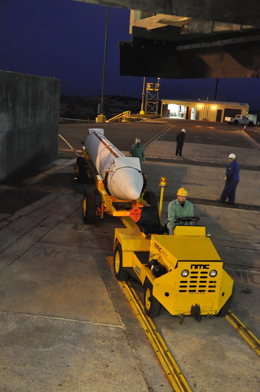 VANDENBERG AIR FORCE BASE, Calif. – A solid rocket motor for the Delta II rocket for NASA's Soil Moisture Active Passive mission, or SMAP, is delivered to the mobile service tower at Space Launch Complex 2 on Vandenberg Air Force Base in California.    SMAP will be launched on a Delta II 7320 configuration vehicle featuring a United Launch Alliance first stage booster powered by an Aerojet Rocketdyne RS-27A main engine and three Alliant Techsystems, or ATK, strap-on solid rocket motors. Once on station in Earth orbit, SMAP will provide global measurements of soil moisture and its freeze/thaw state. These measurements will be used to enhance understanding of processes that link the water, energy and carbon cycles, and to extend the capabilities of weather and climate prediction models. SMAP data also will be used to quantify net carbon flux in boreal landscapes and to develop improved flood prediction and drought monitoring capabilities. Launch is scheduled for no earlier than November 2014. To learn more about SMAP, visit http://smap.jpl.nasa.gov.  Photo credit: NASA/Randy Beaudoin