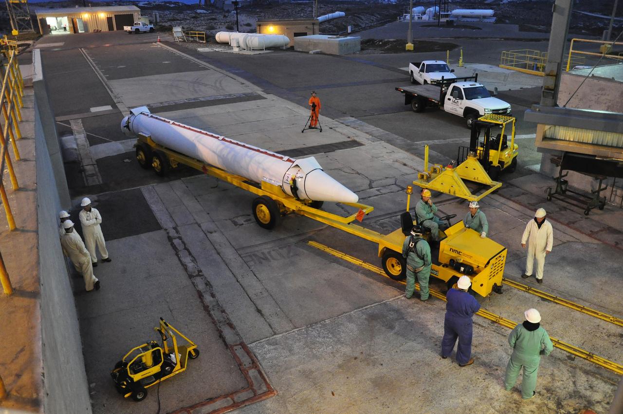 VANDENBERG AIR FORCE BASE, Calif. – Workers deliver a solid rocket motor for the Delta II rocket for NASA's Soil Moisture Active Passive mission, or SMAP, to the mobile service tower at Space Launch Complex 2 on Vandenberg Air Force Base in California.    SMAP will be launched on a Delta II 7320 configuration vehicle featuring a United Launch Alliance first stage booster powered by an Aerojet Rocketdyne RS-27A main engine and three Alliant Techsystems, or ATK, strap-on solid rocket motors. Once on station in Earth orbit, SMAP will provide global measurements of soil moisture and its freeze/thaw state. These measurements will be used to enhance understanding of processes that link the water, energy and carbon cycles, and to extend the capabilities of weather and climate prediction models. SMAP data also will be used to quantify net carbon flux in boreal landscapes and to develop improved flood prediction and drought monitoring capabilities. Launch is scheduled for no earlier than November 2014. To learn more about SMAP, visit http://smap.jpl.nasa.gov.  Photo credit: NASA/Randy Beaudoin