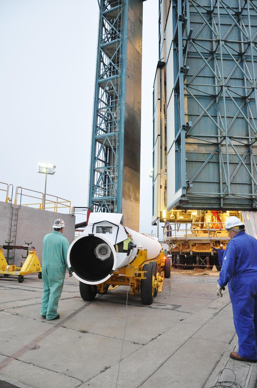 VANDENBERG AIR FORCE BASE, Calif. – Preparations are underway in the mobile service tower at Space Launch Complex 2 on Vandenberg Air Force Base in California to install a solid rocket motor on the Delta II rocket for NASA's Soil Moisture Active Passive mission, or SMAP.    SMAP will be launched on a Delta II 7320 configuration vehicle featuring a United Launch Alliance first stage booster powered by an Aerojet Rocketdyne RS-27A main engine and three Alliant Techsystems, or ATK, strap-on solid rocket motors. Once on station in Earth orbit, SMAP will provide global measurements of soil moisture and its freeze/thaw state. These measurements will be used to enhance understanding of processes that link the water, energy and carbon cycles, and to extend the capabilities of weather and climate prediction models. SMAP data also will be used to quantify net carbon flux in boreal landscapes and to develop improved flood prediction and drought monitoring capabilities. Launch is scheduled for no earlier than November 2014. To learn more about SMAP, visit http://smap.jpl.nasa.gov.  Photo credit: NASA/Randy Beaudoin