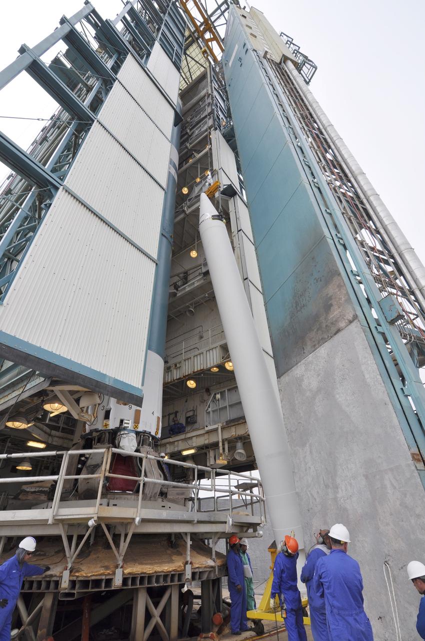 VANDENBERG AIR FORCE BASE, Calif. – A second solid rocket motor for the Delta II rocket for NASA's Soil Moisture Active Passive mission, or SMAP, glides into position beside the rocket's first stage in the mobile service tower at Space Launch Complex 2 on Vandenberg Air Force Base in California.    SMAP will be launched on a Delta II 7320 configuration vehicle featuring a United Launch Alliance first stage booster powered by an Aerojet Rocketdyne RS-27A main engine and three Alliant Techsystems, or ATK, strap-on solid rocket motors. Once on station in Earth orbit, SMAP will provide global measurements of soil moisture and its freeze/thaw state. These measurements will be used to enhance understanding of processes that link the water, energy and carbon cycles, and to extend the capabilities of weather and climate prediction models. SMAP data also will be used to quantify net carbon flux in boreal landscapes and to develop improved flood prediction and drought monitoring capabilities. Launch is scheduled for no earlier than November 2014. To learn more about SMAP, visit http://smap.jpl.nasa.gov.  Photo credit: NASA/Randy Beaudoin