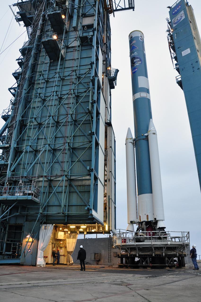VANDENBERG AIR FORCE BASE, Calif. – The mobile service tower at Space Launch Complex 2 on Vandenberg Air Force Base in California is rolled back from the first stage of the Delta II rocket for NASA's Soil Moisture Active Passive mission, or SMAP, during preparations for the arrival of the rocket's second stage.     Operations are underway to install the second stage atop the rocket's first stage. SMAP will launch on a Delta II 7320 configuration vehicle featuring a United Launch Alliance first stage booster powered by an Aerojet Rocketdyne RS-27A main engine and three Alliant Techsystems, or ATK, strap-on solid rocket motors. Once on station in Earth orbit, SMAP will provide global measurements of soil moisture and its freeze/thaw state. These measurements will be used to enhance understanding of processes that link the water, energy and carbon cycles, and to extend the capabilities of weather and climate prediction models. SMAP data also will be used to quantify net carbon flux in boreal landscapes and to develop improved flood prediction and drought monitoring capabilities. Launch is scheduled for no earlier than November 2014. To learn more about SMAP, visit http://smap.jpl.nasa.gov.  Photo credit: NASA/Randy Beaudoin