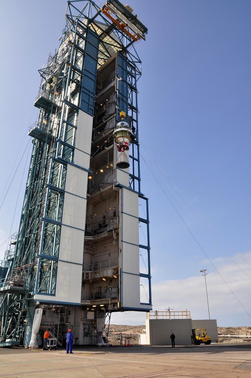 VANDENBERG AIR FORCE BASE, Calif. – A crane hoists the second stage of the Delta II rocket for NASA's Soil Moisture Active Passive mission, or SMAP, to the top of the mobile service tower at Space Launch Complex 2 on Vandenberg Air Force Base in California.    Operations are underway to install the second stage atop the rocket's first stage. SMAP will launch on a Delta II 7320 configuration vehicle featuring a United Launch Alliance first stage booster powered by an Aerojet Rocketdyne RS-27A main engine and three Alliant Techsystems, or ATK, strap-on solid rocket motors. Once on station in Earth orbit, SMAP will provide global measurements of soil moisture and its freeze/thaw state. These measurements will be used to enhance understanding of processes that link the water, energy and carbon cycles, and to extend the capabilities of weather and climate prediction models. SMAP data also will be used to quantify net carbon flux in boreal landscapes and to develop improved flood prediction and drought monitoring capabilities. Launch is scheduled for no earlier than November 2014. To learn more about SMAP, visit http://smap.jpl.nasa.gov.  Photo credit: NASA/Randy Beaudoin