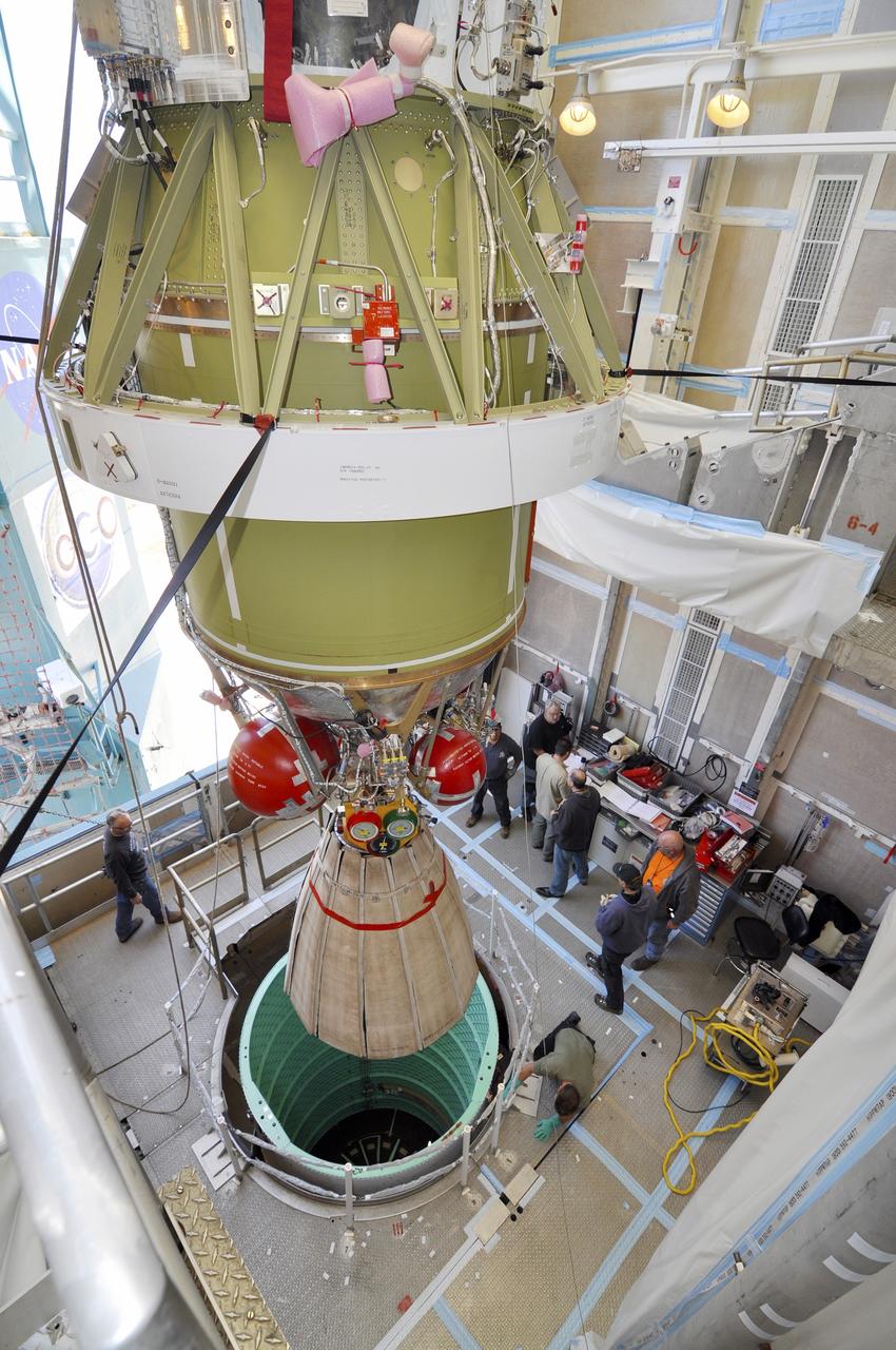 VANDENBERG AIR FORCE BASE, Calif. – The second stage of the Delta II rocket for NASA's Soil Moisture Active Passive mission, or SMAP, is lowered onto the rocket's first stage in the mobile service tower at Space Launch Complex 2 on Vandenberg Air Force Base in California.    Operations are underway to install the second stage atop the rocket's first stage. SMAP will launch on a Delta II 7320 configuration vehicle featuring a United Launch Alliance first stage booster powered by an Aerojet Rocketdyne RS-27A main engine and three Alliant Techsystems, or ATK, strap-on solid rocket motors. Once on station in Earth orbit, SMAP will provide global measurements of soil moisture and its freeze/thaw state. These measurements will be used to enhance understanding of processes that link the water, energy and carbon cycles, and to extend the capabilities of weather and climate prediction models. SMAP data also will be used to quantify net carbon flux in boreal landscapes and to develop improved flood prediction and drought monitoring capabilities. Launch is scheduled for no earlier than November 2014. To learn more about SMAP, visit http://smap.jpl.nasa.gov.  Photo credit: NASA/Randy Beaudoin