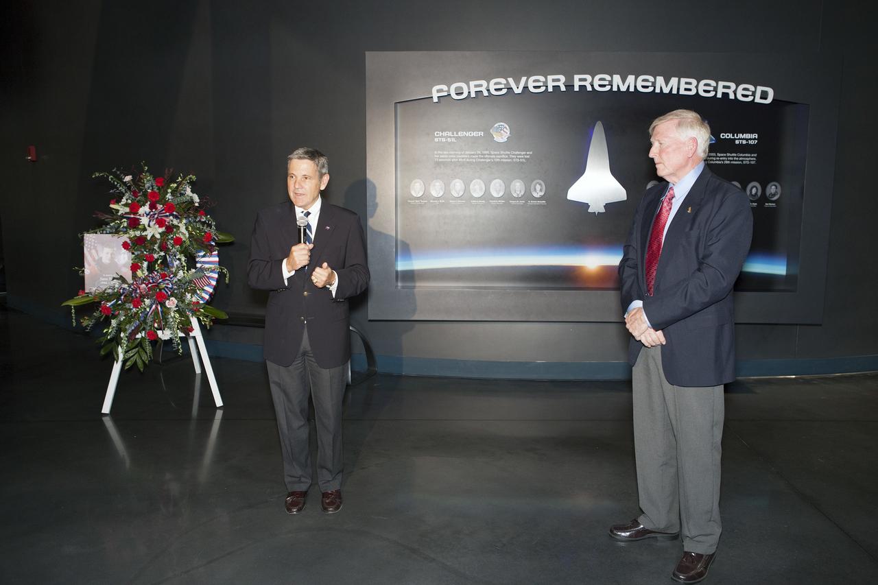 CAPE CANAVERAL, Fla. -- Kennedy Space Center Director Bob Cabana speaks at a wreath-laying ceremony honoring former NASA astronaut Steven R. Nagel at the Space Shuttle Atlantis exhibit at the Kennedy Space Center Visitor Complex in Florida. Former NASA astronaut Jon McBride looks on, at right. Nagel died Aug. 21 after a long illness. He was 67 years old. Nagel served as a mission specialist on his first space shuttle flight, STS-51G, in 1985. He was pilot on his second shuttle flight, STS-61A, also in 1985. He commanded his final two flights, STS-37 and STS-55, in 1991 and 1993, respectively. He logged a total of 723 hours in space. To learn more about Nagel's career, visit http://www.nasa.gov/press/2014/august/former-nasa-astronaut-steven-nagel-veteran-of-four-shuttle-flights-dies-at-67/. Photo credit: NASA/Dimitri Gerondidakis