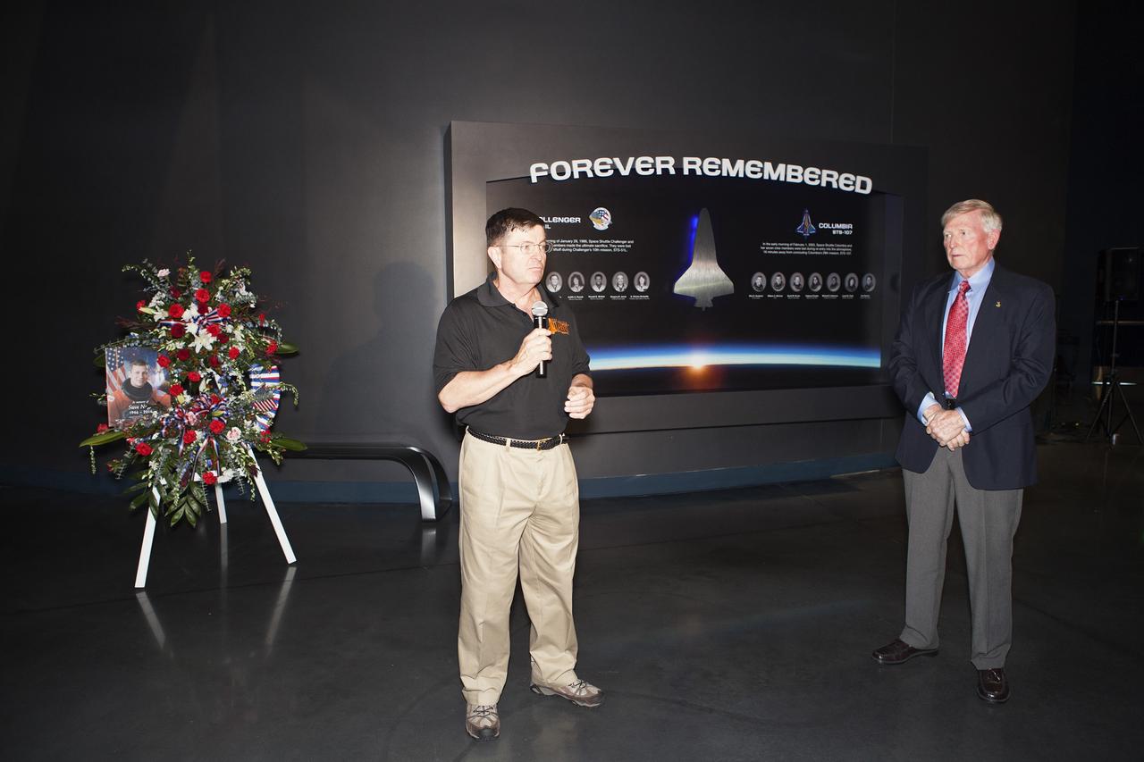 CAPE CANAVERAL, Fla. – Former NASA astronaut Jon McBride speaks at a wreath-laying ceremony honoring former NASA astronaut Steven R. Nagel at the Space Shuttle Atlantis exhibit at the Kennedy Space Center Visitor Complex in Florida. Nagel died Aug. 21 after a long illness. He was 67 years old. Nagel served as a mission specialist on his first space shuttle flight, STS-51G, in 1985. He was pilot on his second shuttle flight, STS-61A, also in 1985. He commanded his final two flights, STS-37 and STS-55, in 1991 and 1993, respectively. He logged a total of 723 hours in space. To learn more about Nagel's career, visit http://www.nasa.gov/press/2014/august/former-nasa-astronaut-steven-nagel-veteran-of-four-shuttle-flights-dies-at-67/. Photo credit: NASA/Dimitri Gerondidakis
