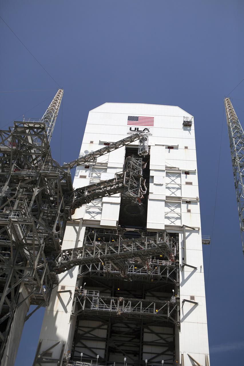 CAPE CANAVERAL, Fla. – The umbilical swing arm for Orion's Exploration Flight Test 1, or EFT-1, has been attached to the uppermost location on the fixed umbilical tower at Space Launch Complex 37 at Cape Canaveral Air Force Station in Florida. All three swing arms on the tower are undergoing tests to confirm that they are operating correctly. They are being swung out and closer to the Vertical Integration Facility at the pad. The uppermost swing arm will carry umbilicals that will be mated to Orion's launch abort system and environmental control system. During launch, all three umbilicals will pull away from Orion and the United Launch Alliance Delta IV Heavy rocket at T-0. During the EFT-1 mission, Orion will travel farther into space than any human spacecraft has gone in more than 40 years. The data gathered during the flight will influence design decisions, validate existing computer models and innovative new approaches to space systems development, as well as reduce overall mission risks and costs for later Orion flights. Liftoff of Orion on its first flight test is planned for fall 2014. Photo credit: NASA/Daniel Casper