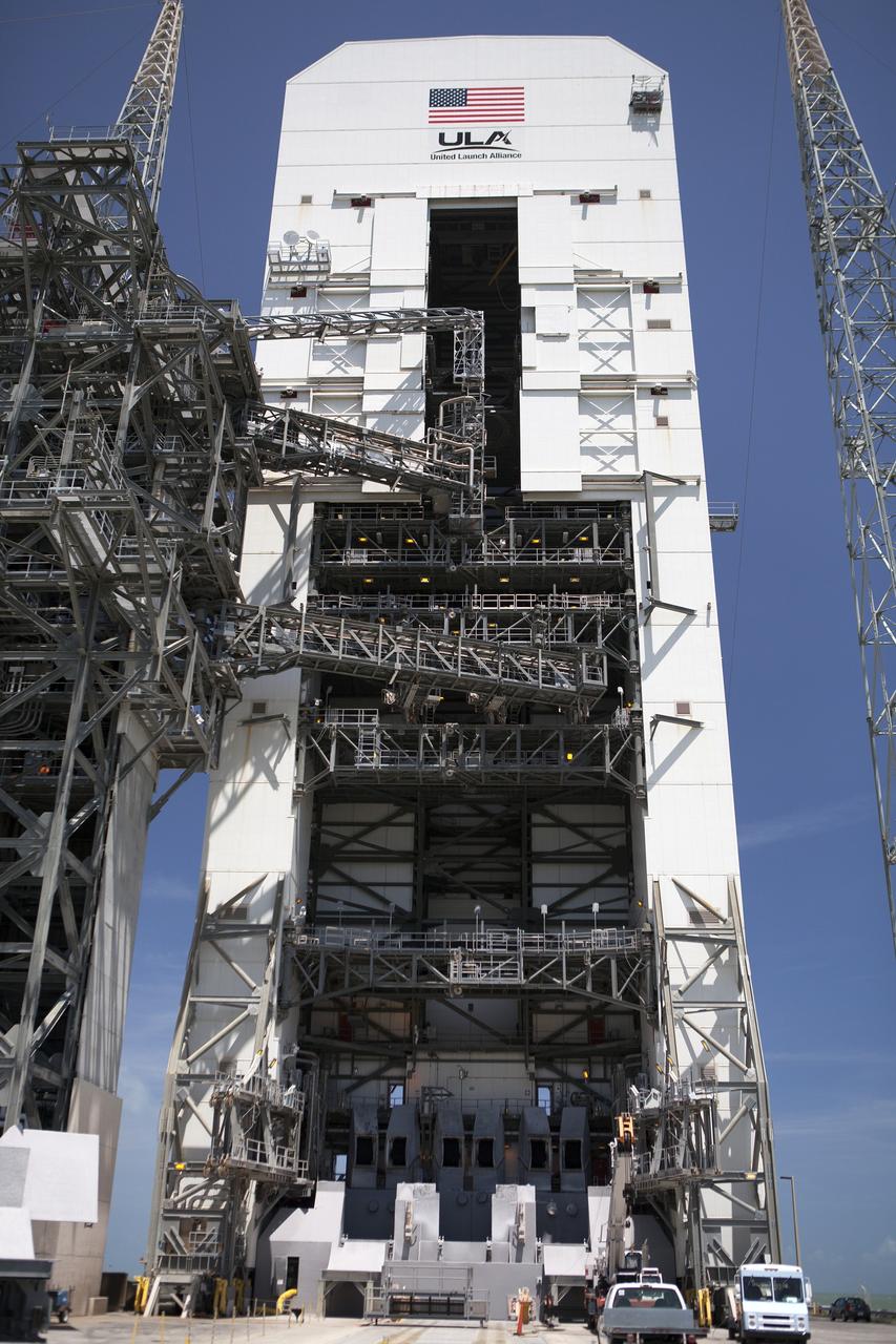 CAPE CANAVERAL, Fla. – The umbilical swing arm for Orion's Exploration Flight Test 1, or EFT-1, has been attached to the uppermost location on the fixed umbilical tower at Space Launch Complex 37 at Cape Canaveral Air Force Station in Florida. All three swing arms on the tower are undergoing tests to confirm that they are operating correctly. They are being swung out and closer to the Vertical Integration Facility at the pad.    The uppermost swing arm will carry umbilicals that will be mated to Orion's launch abort system and environmental control system. During launch, all three umbilicals will pull away from Orion and the United Launch Alliance Delta IV Heavy rocket at T-0. During the EFT-1 mission, Orion will travel farther into space than any human spacecraft has gone in more than 40 years.  The data gathered during the flight will influence design decisions, validate existing computer models and innovative new approaches to space systems development, as well as reduce overall mission risks and costs for later Orion flights. Liftoff of Orion on its first flight test is planned for fall 2014. Photo credit: NASA/Daniel Casper