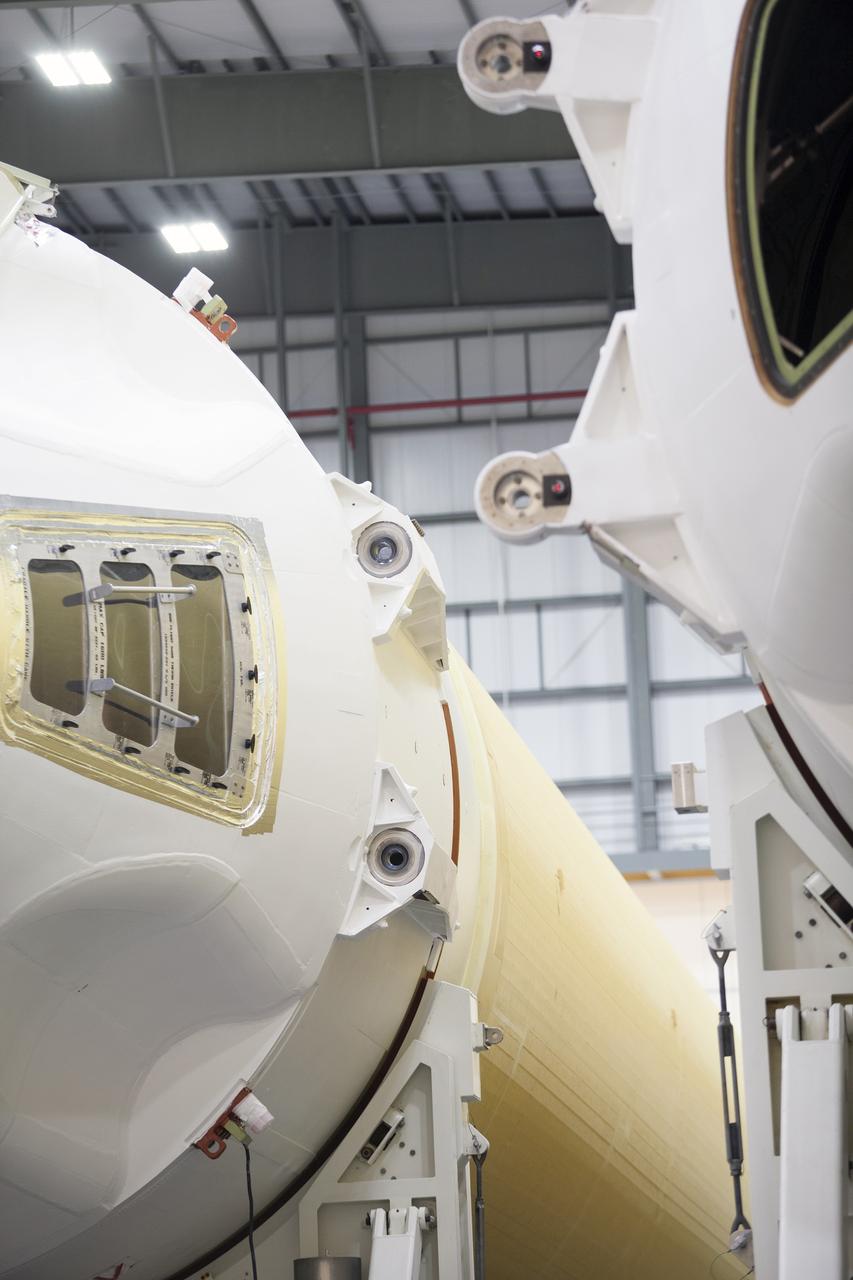 CAPE CANAVERAL, Fla. – In this close-up photograph, the United Launch Alliance Delta IV port booster is being mated to the core booster inside the Horizontal Integration Facility at Space Launch Complex 37 on Cape Canaveral Air Force Station in Florida. The Delta IV Heavy rocket will launch an uncrewed Orion spacecraft on Exploration Flight Test-1. During the mission, Orion will travel farther into space than any human spacecraft has gone in more than 40 years. The data gathered during the flight will influence design decisions, validate existing computer models and innovative new approaches to space systems development, as well as reduce overall mission risks and costs for later Orion flights. Liftoff of Orion on the first flight test is planned for December 2014. Photo credit: NASA/Ben Smegelsky