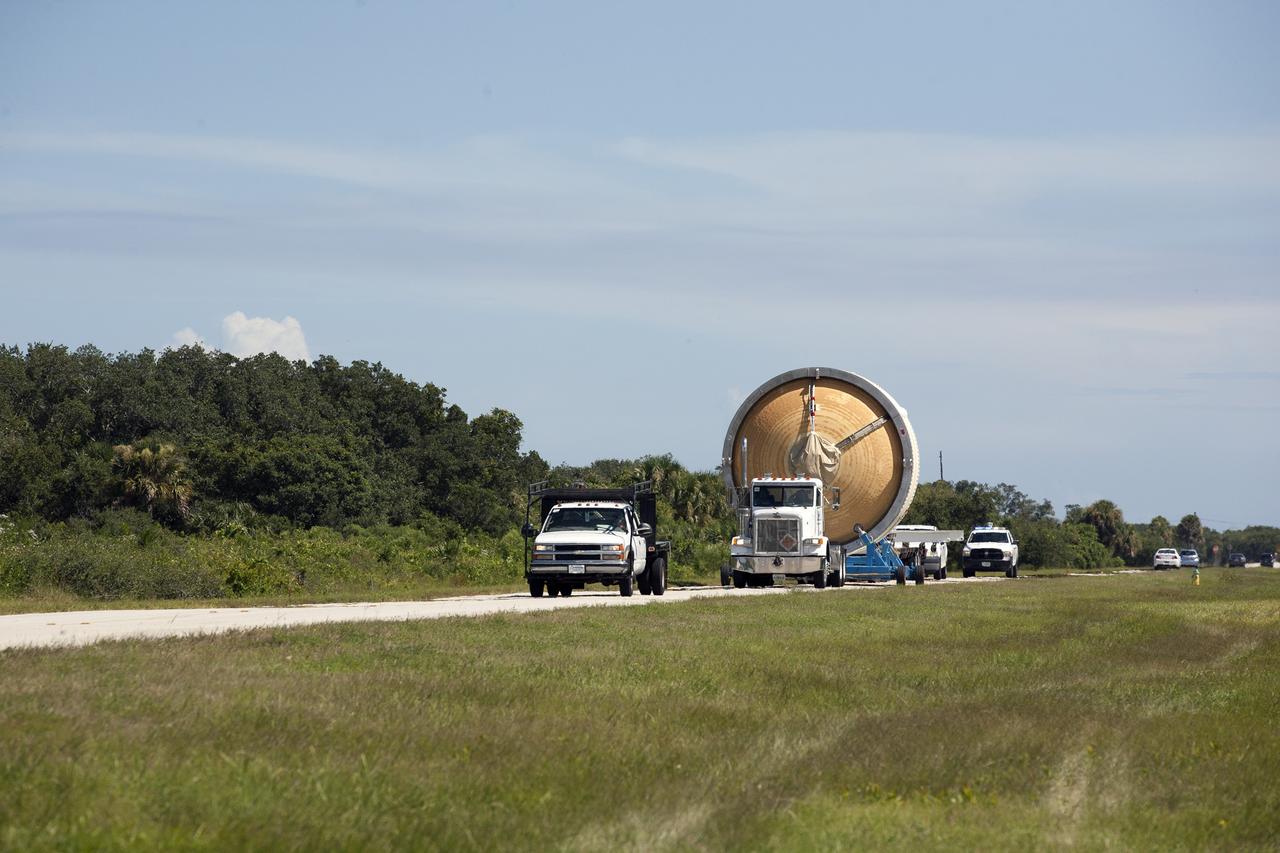 CAPE CANAVERAL, Fla. – At Cape Canaveral Air Force Station, United Launch Alliance technicians transport the second stage of a Delta IV Heavy rocket to the Horizontal Integration Facility at Space Launch Complex 37. The second stage then will be mated with the Delta IV Heavy booster stages in preparation for the unpiloted Exploration Flight Test-1, or EFT-1. During the mission, Orion will travel farther into space than any human spacecraft has gone in more than 40 years. The data gathered during the flight will influence design decisions, validate existing computer models and innovative new approaches to space systems development, as well as reduce overall mission risks and costs for later Orion flights. Liftoff of Orion on the first flight test is planned for December 2014. Photo credit: NASA/Kim Shiflett