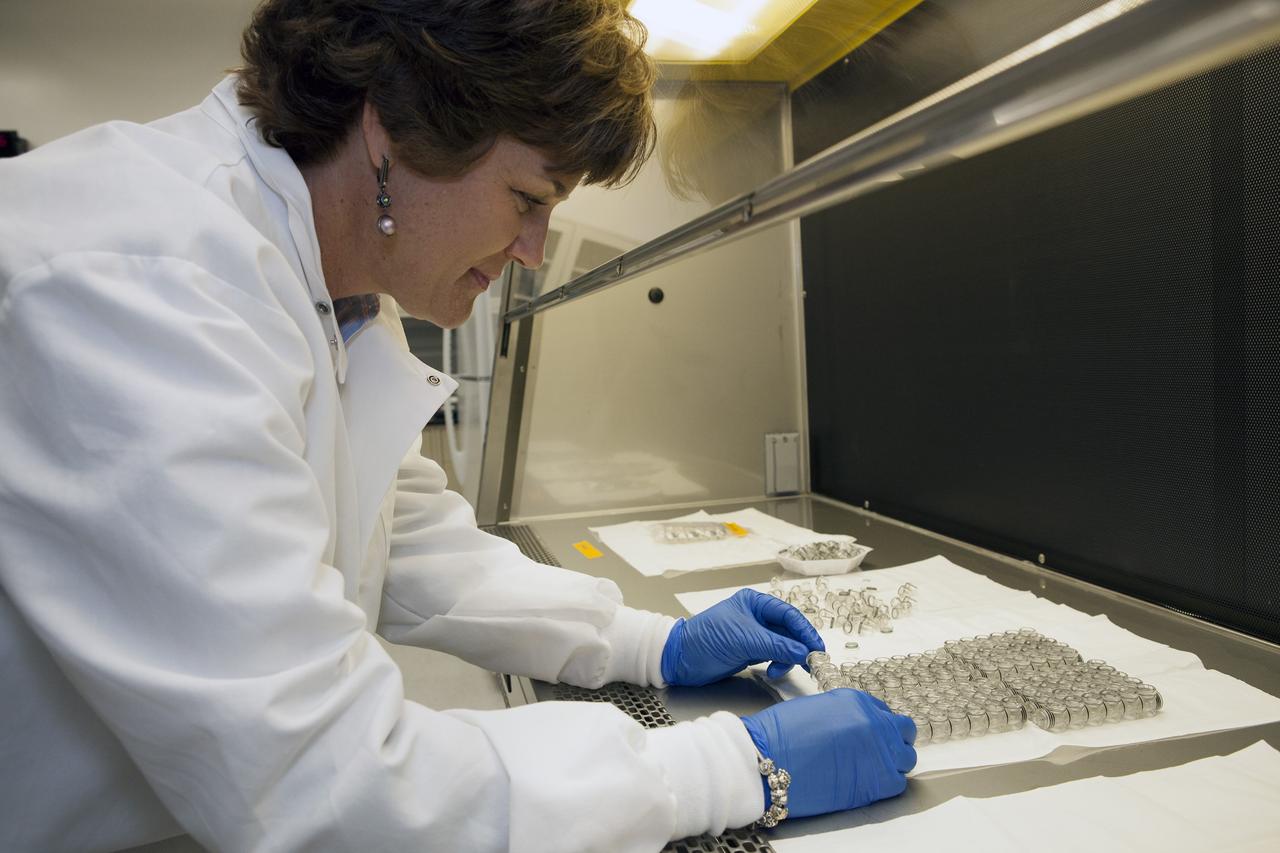 CAPE CANAVERAL, Fla. – Inside a laboratory in the Space Station Processing Facility at NASA's Kennedy Space Center in Florida, April Spinale, a payload integration specialist with Bionetics, cleans the vials that will hold the Protein Crystal Growth 2 samples for the Center for Advancement of Science in Space, or CASIS. The experiment is one of many that will be delivered to the International Space Station on the SpaceX-4 commercial cargo resupply mission. The CASIS experiment will be used in the National Laboratory on the space station. Kennedy's ISS Ground Processing and Research Project Office is providing the necessary laboratories, equipment, supplies and consumables for 61 principal investigators, including 17 from other countries, as they prepare their science experiments for flight. The SpaceX-4 flight is targeted to launch in September 2014. Photo credit: NASA/Dimitri Gerondidakis