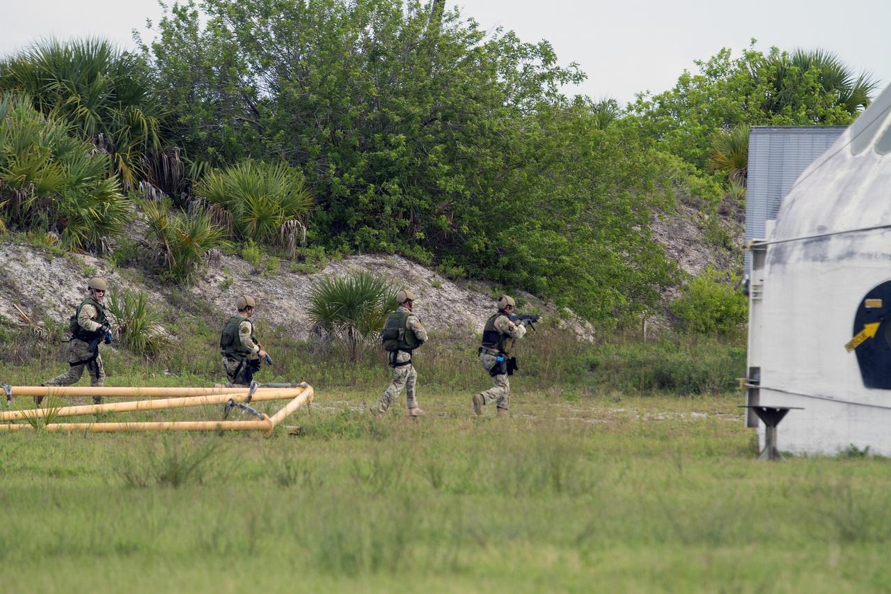 CAPE CANAVERAL, Fla. – Emergency Response Team officers from the Protective Services branch of NASA's Kennedy Space Center in Florida move toward an objective during a training exercise simulating a situation the team could confront at the center. Photo credit: NASA/Dan Casper