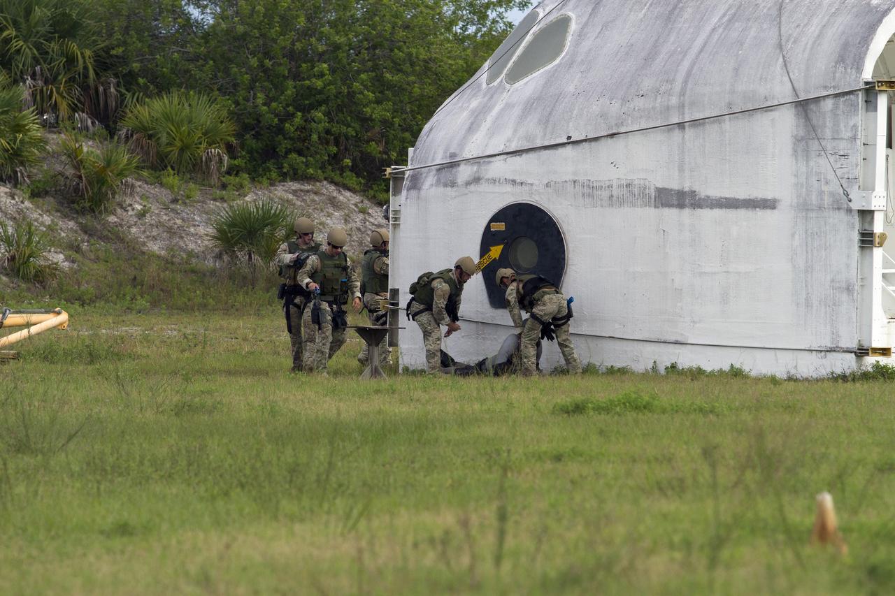 CAPE CANAVERAL, Fla. – Emergency Response Team officers from the Protective Services branch of NASA's Kennedy Space Center in Florida operate near an objective during a training exercise simulating a situation the team could confront at the center. Photo credit: NASA/Dan Casper
