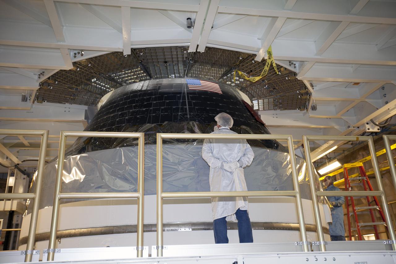 CAPE CANAVERAL, Fla. – Inside the Neil Armstrong Operations and Checkout Building high bay at NASA's Kennedy Space Center in Florida, preparations are underway to lift the Orion crew and service module stack for Exploration Flight Test-1 out of the test cell and transfer it to a mating device.    Orion is the exploration spacecraft designed to carry astronauts to destinations not yet explored by humans, including an asteroid and Mars. It will have emergency abort capability, sustain the crew during space travel and provide safe re-entry from deep space return velocities. The first unpiloted test flight of the Orion is scheduled to launch later this year atop a Delta IV Heavy rocket from Cape Canaveral Air Force Station in Florida to an altitude of 3,600 miles above the Earth's surface. The two-orbit, four-hour flight test will help engineers evaluate the systems critical to crew safety including the heat shield, parachute system and launch abort system. For more information, visit http://www.nasa.gov/orion. Photo credit: NASA/Ben Smegelsky