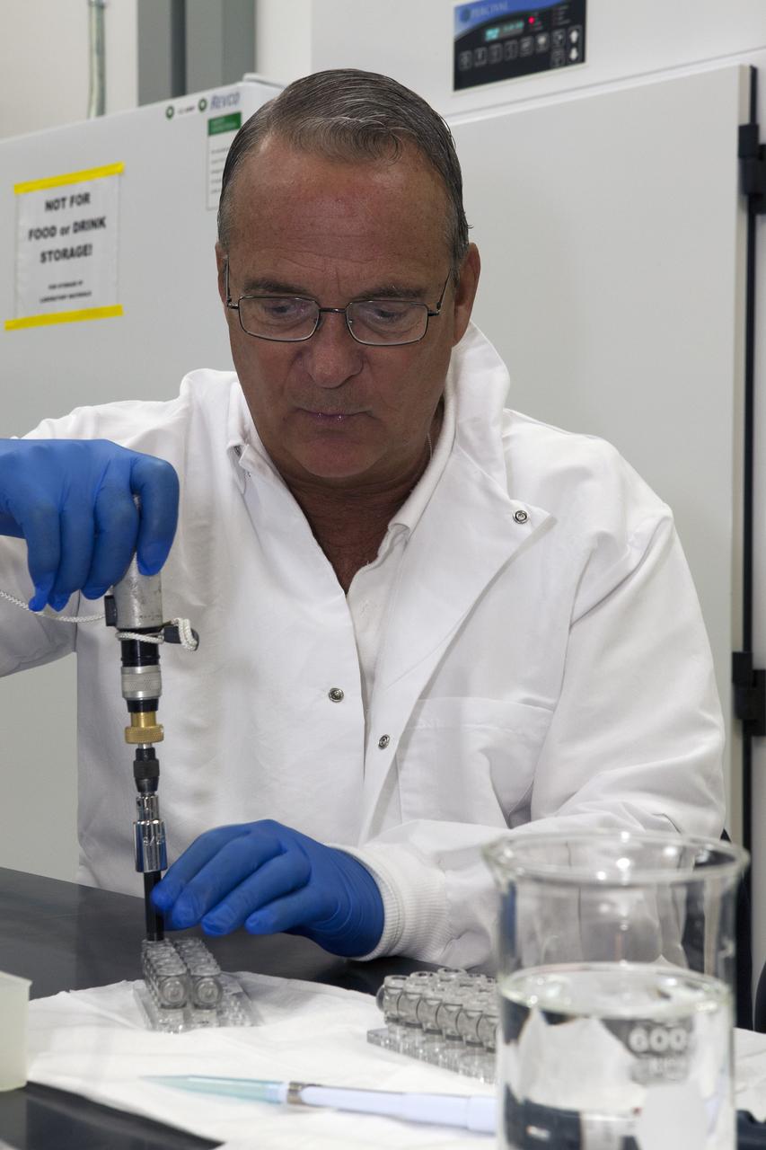CAPE CANAVERAL, Fla. – Inside a laboratory in the Space Station Processing Facility at NASA's Kennedy Space Center in Florida, Ray Polniak, a quality assurance specialist with Dynamac, prepares vials for the Crystal Protein Growth 2 experiment for an acceptance leak test. Polniak is a consultant for the Center for Advancement of Science is Space, or CASIS. The experiment is one of many that will be delivered to the International Space Station on the SpaceX-4 commercial cargo resupply mission. Kennedy's ISS Ground Processing and Research Project Office is providing the necessary laboratories, equipment, supplies and consumables for 61 principal investigators, including 17 from other countries, as they prepare their science experiments for flight. The SpaceX-4 flight is targeted to launch in September 2014. Photo credit: NASA/Dimitri Gerondidakis