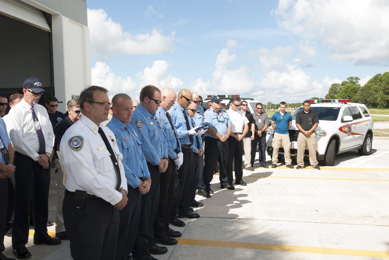 Cape Canaveral, Fla. – At Fire Station 1 at NASA’s Kennedy Space Center in Florida, Fire and Rescue personnel pause for a moment of silence during a ceremony commemorating the 13th anniversary of 9/11 at 10:28 a.m., which was the moment of collapse of the north tower of the World Trade Center. Photo credit: Jim Grossmann