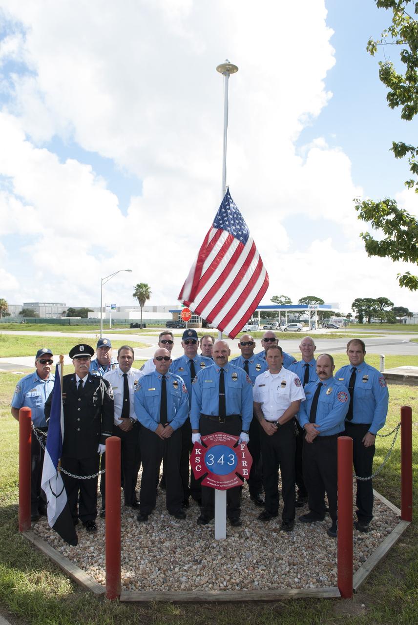 Cape Canaveral, Fla. – At Fire Station 1 at NASA’s Kennedy Space Center in Florida, Fire and Rescue personnel gathered near the 9/11 memorial after a ceremony commemorating the 13th anniversary of 9/11 with a ceremony that included a minute of silence at 10:28 a.m., which was the moment of collapse of the north tower of the World Trade Center. Photo credit: Jim Grossmann