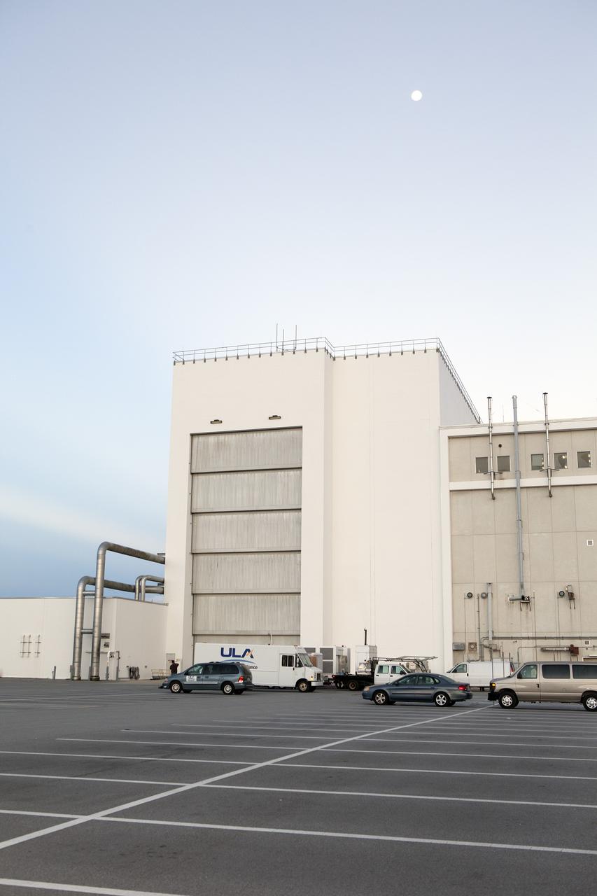 CAPE CANAVERAL, Fla. – Preparations are underway at the Neil Armstrong Operations and Checkout Building at NASA's Kennedy Space Center in Florida for the move of the Orion spacecraft for Exploration Flight Test-1 out of the high bay doors. The spacecraft will be transported to the Payload Hazardous Servicing Facility where it will be fueled ahead of its December flight test. Orion is the exploration spacecraft designed to carry astronauts to destinations not yet explored by humans, including an asteroid and Mars. It will have emergency abort capability, sustain the crew during space travel and provide safe re-entry from deep space return velocities. The first unpiloted test flight of the Orion is scheduled to launch atop a United Launch Alliance Delta IV Heavy rocket from Cape Canaveral Air Force Station in Florida to an altitude of 3,600 miles above the Earth's surface. The two-orbit, four-hour flight test will help engineers evaluate the systems critical to crew safety including the heat shield, parachute system and launch abort system. For more information, visit http://www.nasa.gov/orion. Photo credit: NASA/Daniel Casper