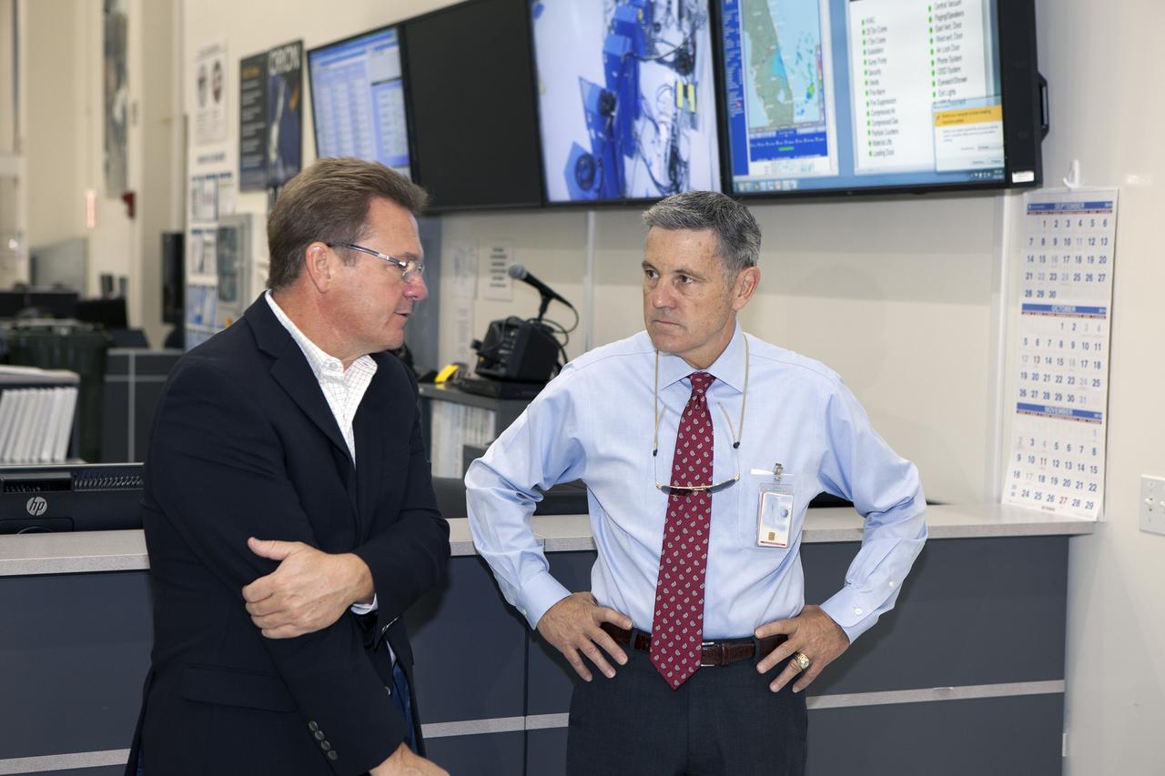 CAPE CANAVERAL, Fla. – Preparations are underway at the Neil Armstrong Operations and Checkout Building at NASA's Kennedy Space Center in Florida for the move of the Orion spacecraft for Exploration Flight Test-1 out of the high bay doors. Inside the high bay from left, are Jules Schneider, Lockheed Martin senior manager, and Kennedy Center Director Bob Cabana. The spacecraft will be transported to the Payload Hazardous Servicing Facility where it will be fueled ahead of its December flight test. Orion is the exploration spacecraft designed to carry astronauts to destinations not yet explored by humans, including an asteroid and Mars. It will have emergency abort capability, sustain the crew during space travel and provide safe re-entry from deep space return velocities. The first unpiloted test flight of the Orion is scheduled to launch atop a United Launch Alliance Delta IV Heavy rocket from Cape Canaveral Air Force Station in Florida to an altitude of 3,600 miles above the Earth's surface. The two-orbit, four-hour flight test will help engineers evaluate the systems critical to crew safety including the heat shield, parachute system and launch abort system. For more information, visit http://www.nasa.gov/orion. Photo credit: NASA/Daniel Casper