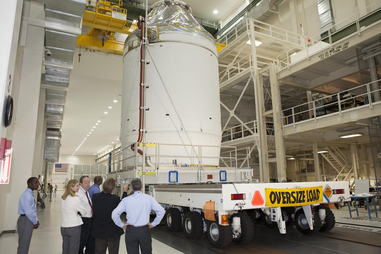 CAPE CANAVERAL, Fla. – The Orion crew module, stacked atop its service module, is being prepared for its move out of the Neil Armstrong Operations and Checkout Building high bay at NASA's Kennedy Space Center in Florida. The spacecraft for Exploration Flight Test-1 will be transported to the Payload Hazardous Servicing Facility where it will be fueled ahead of its December flight test.      Orion is the exploration spacecraft designed to carry astronauts to destinations not yet explored by humans, including an asteroid and Mars. It will have emergency abort capability, sustain the crew during space travel and provide safe re-entry from deep space return velocities. The first unpiloted test flight of the Orion is scheduled to launch atop a United Launch Alliance Delta IV Heavy rocket from Cape Canaveral Air Force Station in Florida to an altitude of 3,600 miles above the Earth's surface. The two-orbit, four-hour flight test will help engineers evaluate the systems critical to crew safety including the heat shield, parachute system and launch abort system. For more information, visit http://www.nasa.gov/orion. Photo credit: NASA/Daniel Casper