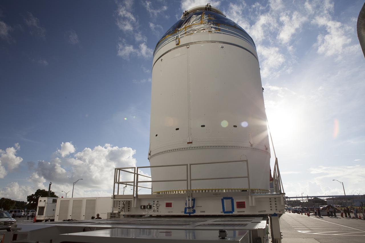 CAPE CANAVERAL, Fla. – The Orion crew module, stacked atop its service module, has moved out of the Neil Armstrong Operations and Checkout Building high bay at NASA's Kennedy Space Center in Florida. The spacecraft for Exploration Flight Test-1 will be transported to the Payload Hazardous Servicing Facility where it will be fueled ahead of its December flight test.    Orion is the exploration spacecraft designed to carry astronauts to destinations not yet explored by humans, including an asteroid and Mars. It will have emergency abort capability, sustain the crew during space travel and provide safe re-entry from deep space return velocities. The first unpiloted test flight of the Orion is scheduled to launch atop a United Launch Alliance Delta IV Heavy rocket from Cape Canaveral Air Force Station in Florida to an altitude of 3,600 miles above the Earth's surface. The two-orbit, four-hour flight test will help engineers evaluate the systems critical to crew safety including the heat shield, parachute system and launch abort system. For more information, visit http://www.nasa.gov/orion. Photo credit: NASA/Daniel Casper
