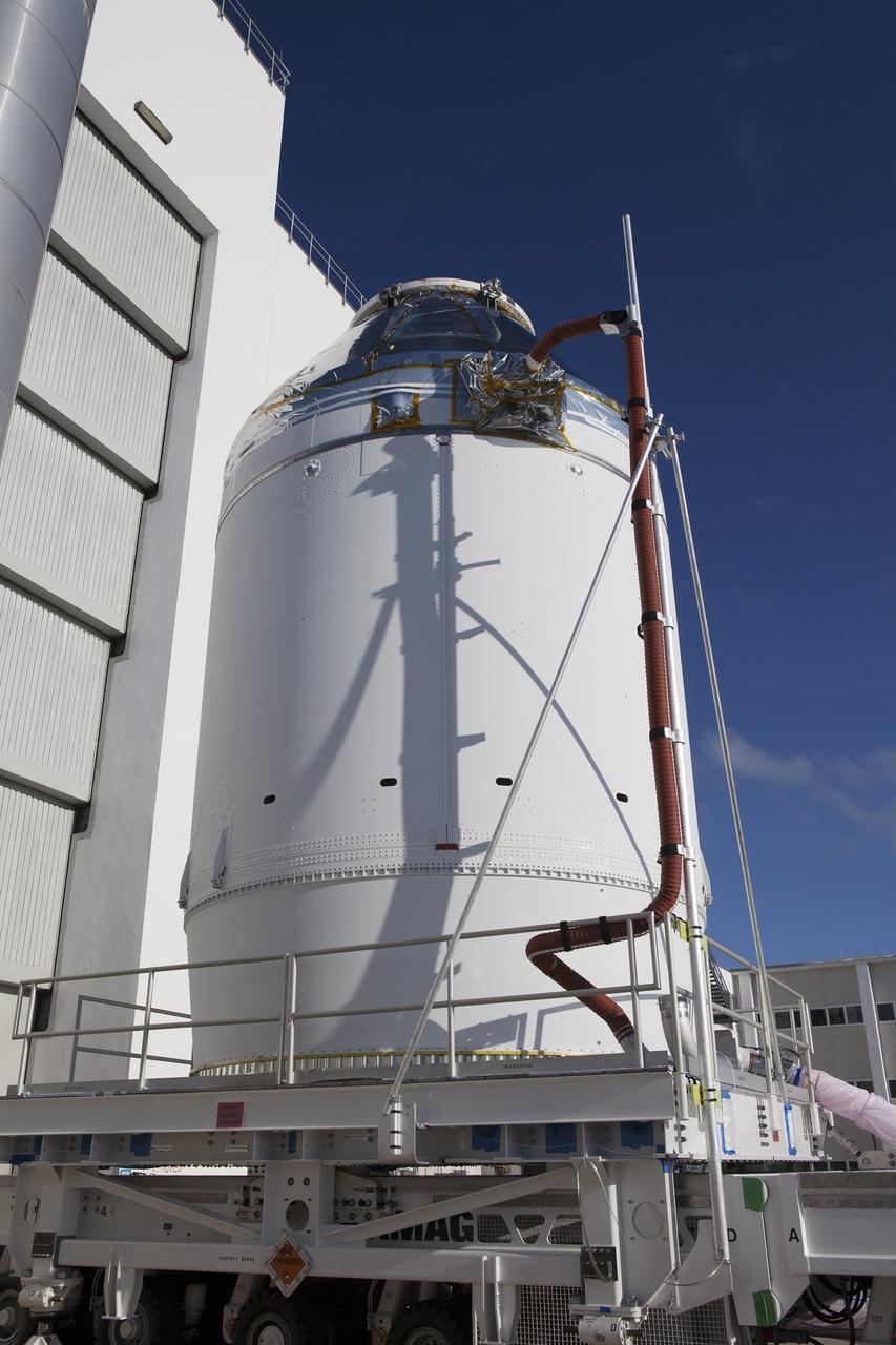 CAPE CANAVERAL, Fla. – The Orion crew module, stacked atop its service module, has moved out of the Neil Armstrong Operations and Checkout Building high bay at NASA's Kennedy Space Center in Florida. The spacecraft for Exploration Flight Test-1 will be transported to the Payload Hazardous Servicing Facility where it will be fueled ahead of its December flight test.    Orion is the exploration spacecraft designed to carry astronauts to destinations not yet explored by humans, including an asteroid and Mars. It will have emergency abort capability, sustain the crew during space travel and provide safe re-entry from deep space return velocities. The first unpiloted test flight of the Orion is scheduled to launch atop a United Launch Alliance Delta IV Heavy rocket from Cape Canaveral Air Force Station in Florida to an altitude of 3,600 miles above the Earth's surface. The two-orbit, four-hour flight test will help engineers evaluate the systems critical to crew safety including the heat shield, parachute system and launch abort system. For more information, visit http://www.nasa.gov/orion. Photo credit: NASA/Daniel Casper