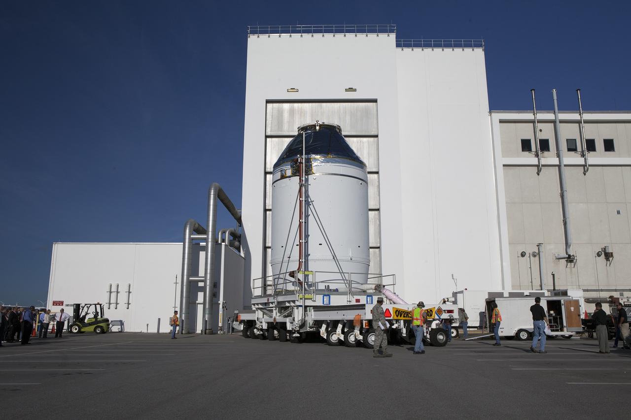 CAPE CANAVERAL, Fla. – The Orion crew module, stacked atop its service module, has moved out of the Neil Armstrong Operations and Checkout Building high bay at NASA's Kennedy Space Center in Florida. The spacecraft for Exploration Flight Test-1 will be transported to the Payload Hazardous Servicing Facility where it will be fueled ahead of its December flight test. Orion is the exploration spacecraft designed to carry astronauts to destinations not yet explored by humans, including an asteroid and Mars. It will have emergency abort capability, sustain the crew during space travel and provide safe re-entry from deep space return velocities. The first unpiloted test flight of the Orion is scheduled to launch atop a United Launch Alliance Delta IV Heavy rocket from Cape Canaveral Air Force Station in Florida to an altitude of 3,600 miles above the Earth's surface. The two-orbit, four-hour flight test will help engineers evaluate the systems critical to crew safety including the heat shield, parachute system and launch abort system. For more information, visit http://www.nasa.gov/orion. Photo credit: NASA/Daniel Casper