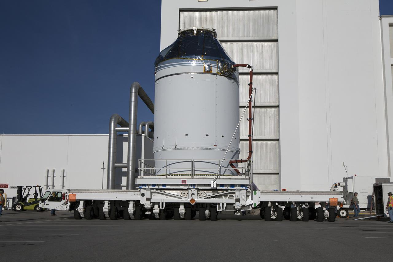 CAPE CANAVERAL, Fla. – The Orion crew module, stacked atop its service module, has moved out of the Neil Armstrong Operations and Checkout Building high bay at NASA's Kennedy Space Center in Florida. The spacecraft for Exploration Flight Test-1 will be transported to the Payload Hazardous Servicing Facility where it will be fueled ahead of its December flight test. Orion is the exploration spacecraft designed to carry astronauts to destinations not yet explored by humans, including an asteroid and Mars. It will have emergency abort capability, sustain the crew during space travel and provide safe re-entry from deep space return velocities. The first unpiloted test flight of the Orion is scheduled to launch atop a United Launch Alliance Delta IV Heavy rocket from Cape Canaveral Air Force Station in Florida to an altitude of 3,600 miles above the Earth's surface. The two-orbit, four-hour flight test will help engineers evaluate the systems critical to crew safety including the heat shield, parachute system and launch abort system. For more information, visit http://www.nasa.gov/orion. Photo credit: NASA/Daniel Casper