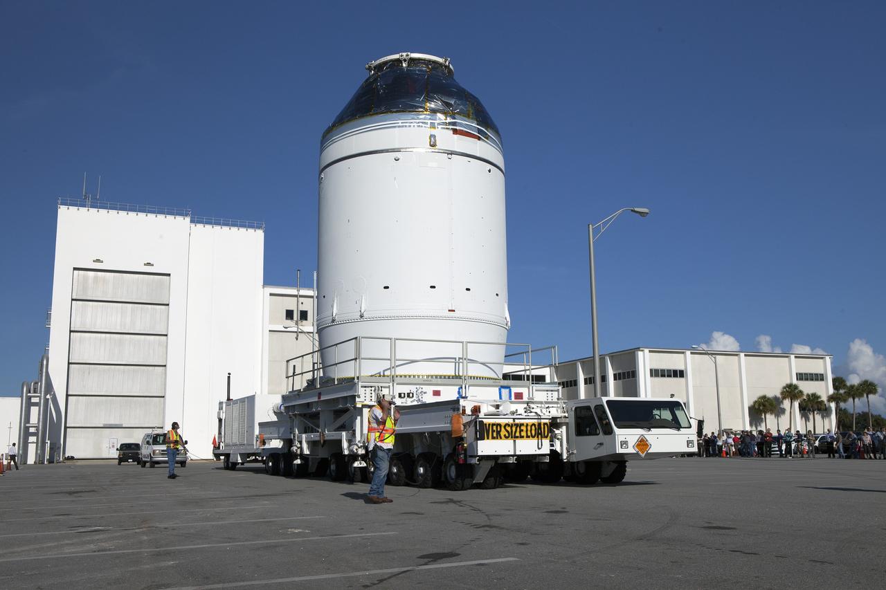 CAPE CANAVERAL, Fla. – The Orion crew module, stacked atop its service module, has moved out of the Neil Armstrong Operations and Checkout Building high bay at NASA's Kennedy Space Center in Florida. The spacecraft for Exploration Flight Test-1 will be transported to the Payload Hazardous Servicing Facility where it will be fueled ahead of its December flight test. Orion is the exploration spacecraft designed to carry astronauts to destinations not yet explored by humans, including an asteroid and Mars. It will have emergency abort capability, sustain the crew during space travel and provide safe re-entry from deep space return velocities. The first unpiloted test flight of the Orion is scheduled to launch atop a United Launch Alliance Delta IV Heavy rocket from Cape Canaveral Air Force Station in Florida to an altitude of 3,600 miles above the Earth's surface. The two-orbit, four-hour flight test will help engineers evaluate the systems critical to crew safety including the heat shield, parachute system and launch abort system. For more information, visit http://www.nasa.gov/orion. Photo credit: NASA/Daniel Casper
