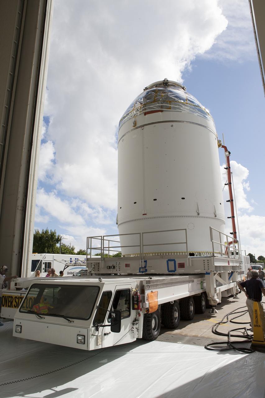 CAPE CANAVERAL, Fla. – The Orion crew module, stacked atop its service module, is transported into the Payload Hazardous Servicing Facility at NASA's Kennedy Space Center in Florida, where it will be fueled ahead of its December flight. The spacecraft for Exploration Flight Test-1 was moved out of the Neil Armstrong Operations and Checkout Building high bay.    Orion is the exploration spacecraft designed to carry astronauts to destinations not yet explored by humans, including an asteroid and Mars. It will have emergency abort capability, sustain the crew during space travel and provide safe re-entry from deep space return velocities. The first unpiloted test flight of the Orion is scheduled to launch atop a United Launch Alliance Delta IV Heavy rocket from Cape Canaveral Air Force Station in Florida to an altitude of 3,600 miles above the Earth's surface. The two-orbit, four-hour flight test will help engineers evaluate the systems critical to crew safety including the heat shield, parachute system and launch abort system. For more information, visit http://www.nasa.gov/orion. Photo credit: NASA/Daniel Casper