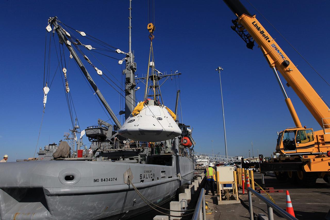 SAN DIEGO, Calif. – At Naval Base San Diego in California, a crane is used to transfer the Orion boilerplate test vehicle into the USS Salvor, a safeguard-class rescue and salvage ship that will be used for Underway Recovery Test 4A. The ship will head out to sea for four days to test crew module crane recovery operations. NASA, Lockheed Martin and the U.S. Navy are conducting the test to prepare for recovery of the Orion crew module on its return from a deep space mission. The underway recovery test will allow the teams to demonstrate and evaluate the recovery processes, procedures, new hardware and personnel in open waters. The Ground Systems Development and Operations Program is conducting the underway recovery test. Orion is the exploration spacecraft designed to carry astronauts to destinations not yet explored by humans, including an asteroid and Mars. It will have emergency abort capability, sustain the crew during space travel and provide safe re-entry from deep space return velocities. The first unpiloted test flight of the Orion is scheduled to launch in December 2014 atop a United Launch Alliance Delta IV rocket and in 2018 on NASA’s Space Launch System rocket. For more information, visit http://www.nasa.gov/orion. Photo credit: Kim Shiflett