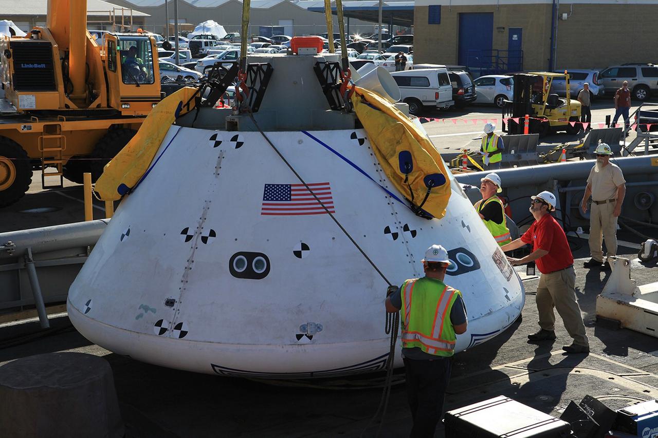 SAN DIEGO, Calif. – At Naval Base San Diego in California, the Orion boilerplate test vehicle has been lowered by crane into the USS Salvor, a safeguard-class rescue and salvage ship that will be used for Underway Recovery Test 4A. The ship will head out to sea for four days to test crew module crane recovery operations. NASA, Lockheed Martin and the U.S. Navy are conducting the test to prepare for recovery of the Orion crew module on its return from a deep space mission. The underway recovery test will allow the teams to demonstrate and evaluate the recovery processes, procedures, new hardware and personnel in open waters. The Ground Systems Development and Operations Program is conducting the underway recovery test. Orion is the exploration spacecraft designed to carry astronauts to destinations not yet explored by humans, including an asteroid and Mars. It will have emergency abort capability, sustain the crew during space travel and provide safe re-entry from deep space return velocities. The first unpiloted test flight of the Orion is scheduled to launch in December 2014 atop a United Launch Alliance Delta IV rocket and in 2018 on NASA’s Space Launch System rocket. For more information, visit http://www.nasa.gov/orion. Photo credit: Kim Shiflett