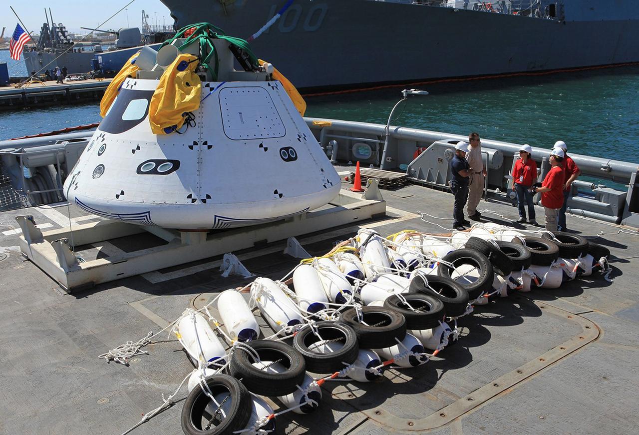SAN DIEGO, Calif. – At Naval Base San Diego in California, the Orion boilerplate test vehicle, hardware and equipment has been loaded into the USS Salvor, a safeguard-class rescue and salvage ship that will be used for Underway Recovery Test 4A. The ship will head out to sea for four days to test crew module crane recovery operations. NASA, Lockheed Martin and the U.S. Navy are conducting the test to prepare for recovery of the Orion crew module on its return from a deep space mission. The underway recovery test will allow the teams to demonstrate and evaluate the recovery processes, procedures, new hardware and personnel in open waters    The Ground Systems Development and Operations Program is conducting the underway recovery test. Orion is the exploration spacecraft designed to carry astronauts to destinations not yet explored by humans, including an asteroid and Mars. It will have emergency abort capability, sustain the crew during space travel and provide safe re-entry from deep space return velocities. The first unpiloted test flight of the Orion is scheduled to launch in December 2014 atop a United Launch Alliance Delta IV rocket and in 2018 on NASA’s Space Launch System rocket. For more information, visit http://www.nasa.gov/orion. Photo credit: Kim Shiflett