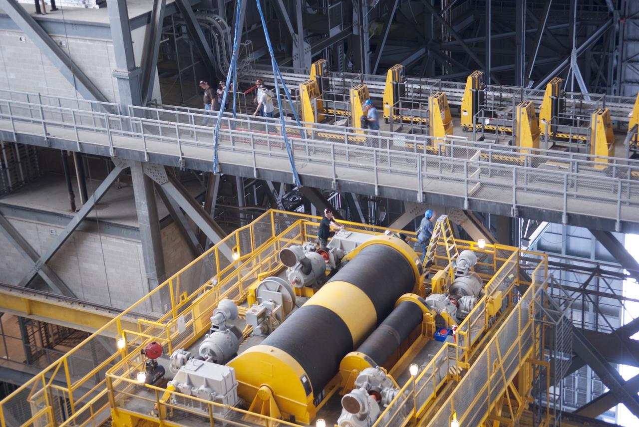 CAPE CANAVERAL, Fla. – Inside the Vehicle Assembly Building, or VAB, at NASA's Kennedy Space Center in Florida, preparations are underway to remove a portion of the catwalk on the west side of Level 16. The catwalk is being removed to allow room for the removal of the 175-ton crane that is situated above the transfer aisle. The crane will be lowered to the floor to perform upgrades to its 45-year-old controls in order to improve reliability, precision and safety. The Ground Systems Development and Operations Program is overseeing upgrades and modifications to the VAB. The crane will be upgraded so that it can support lifting needs for NASA and other exploration vehicles, including the agency's Space Launch System and Orion spacecraft. Photo credit: NASA/Jim Grossmann