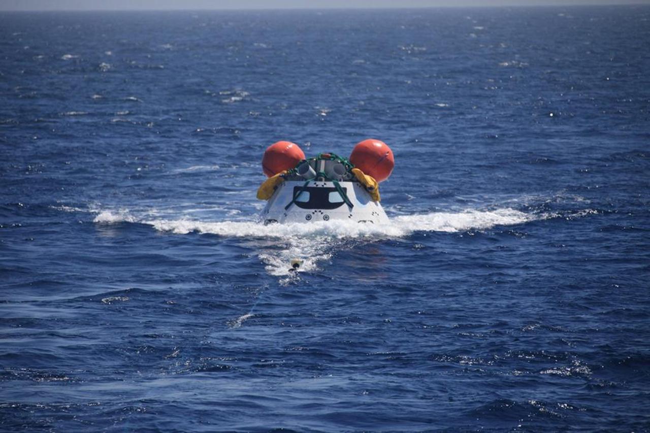 SAN DIEGO, Calif. – The Orion boilerplate test vehicle floats in the Pacific Ocean during the third day of Underway Recovery Test 4A. Orion was lowered into the water from the USS Salvor, a safeguard-class rescue and salvage ship, using a stationary crane. Tether lines were attached to the test vehicle from the ship for a towing test. NASA, Lockheed Martin and the U.S. Navy are conducting the test to prepare for recovery of the Orion crew module on its return from a deep space mission. The underway recovery test allows the teams to demonstrate and evaluate the recovery processes, procedures, new hardware and personnel in open waters.    The Ground Systems Development and Operations Program is conducting the underway recovery test. Orion is the exploration spacecraft designed to carry astronauts to destinations not yet explored by humans, including an asteroid and Mars. It will have emergency abort capability, sustain the crew during space travel and provide safe re-entry from deep space return velocities. The first unpiloted test flight of the Orion is scheduled to launch in December 2014 atop a United Launch Alliance Delta IV Heavy rocket and in 2018 on NASA’s Space Launch System rocket. For more information, visit http://www.nasa.gov/orion. Photo credit: NASA/Kim Shiflett