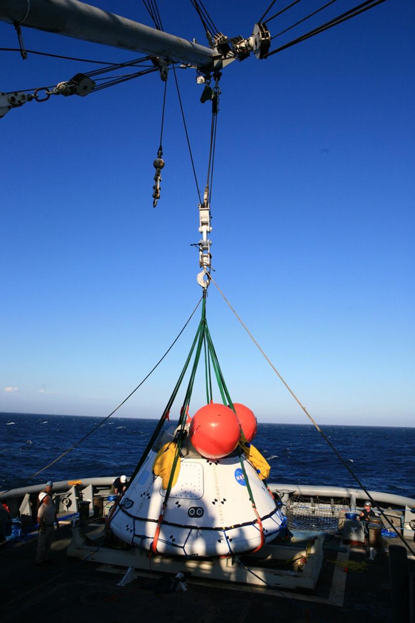 SAN DIEGO, Calif. – On the third day of Underway Recovery Test 4A in the Pacific Ocean, the Orion boilerplate test vehicle has been lifted out of the water and placed in a cradle in the USS Salvor, a safeguard-class rescue and salvage ship, using a stationary crane. NASA, Lockheed Martin and the U.S. Navy are testing crane recovery operations to prepare for recovery of the Orion crew module on its return from a deep space mission. The underway recovery test allows the teams to demonstrate and evaluate the recovery processes, procedures, new hardware and personnel in open waters.    The Ground Systems Development and Operations Program is conducting the underway recovery test. Orion is the exploration spacecraft designed to carry astronauts to destinations not yet explored by humans, including an asteroid and Mars. It will have emergency abort capability, sustain the crew during space travel and provide safe re-entry from deep space return velocities. The first unpiloted test flight of the Orion is scheduled to launch in December 2014 atop a United Launch Alliance Delta IV Heavy rocket and in 2018 on NASA’s Space Launch System rocket. For more information, visit http://www.nasa.gov/orion. Photo credit: NASA/Kim Shiflett